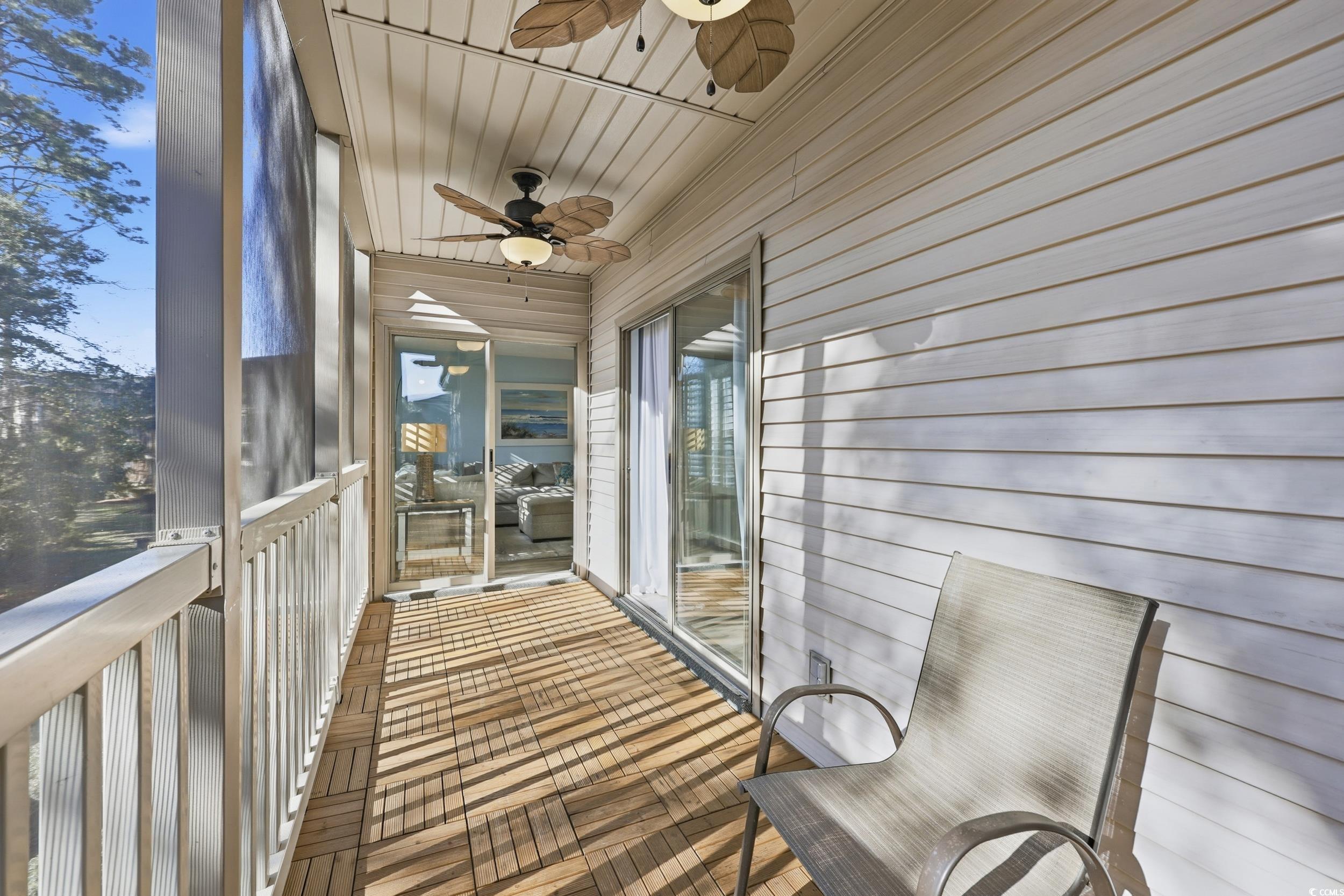 448 Pinehurst Lane, Unit 16F Pawleys Island, SC 29585 - Photo 18 of 31 Unfurnished sunroom featuring a ceiling fan and a balcony