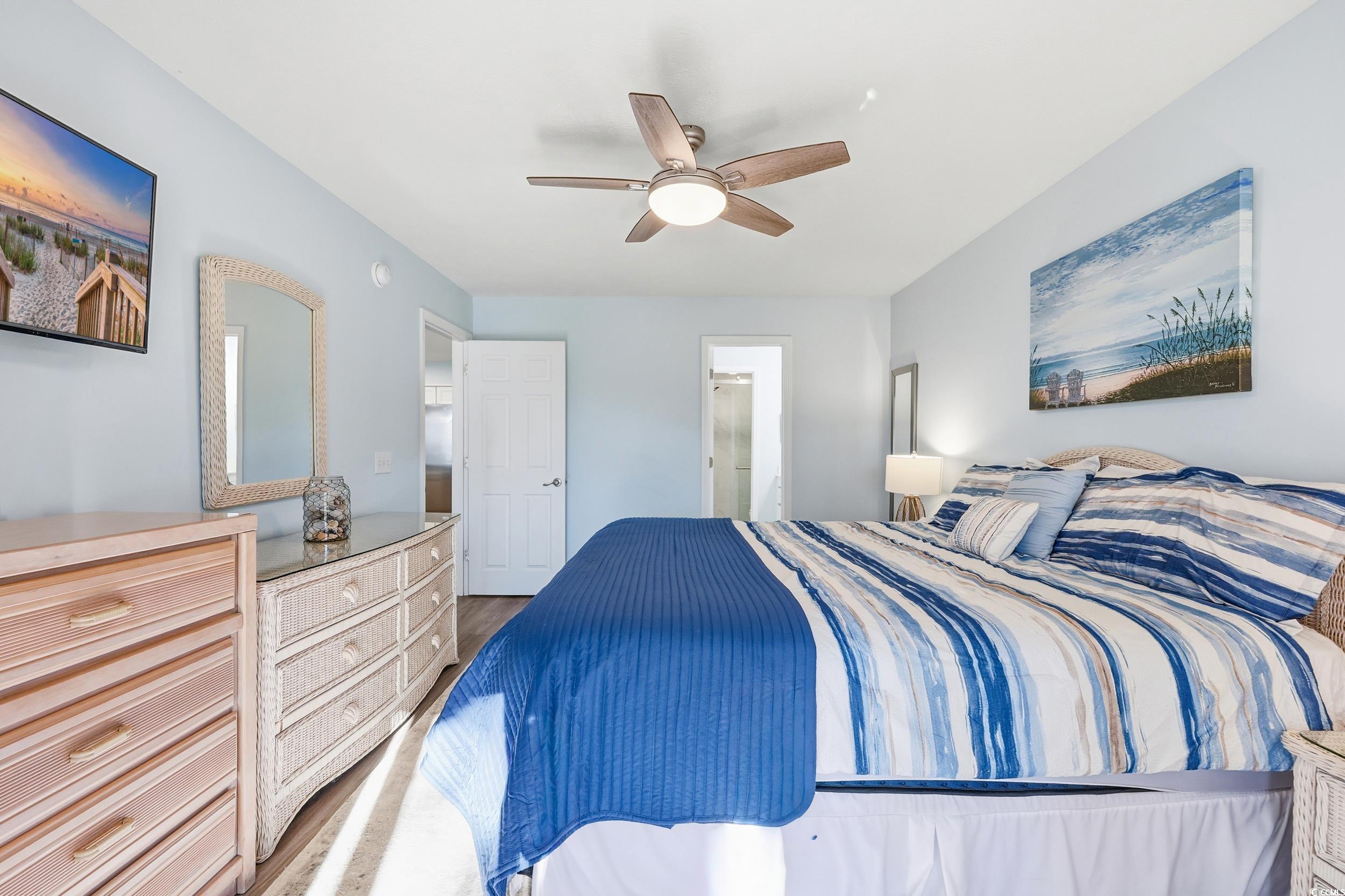 448 Pinehurst Lane, Unit 16F Pawleys Island, SC 29585 - Photo 22 of 31 Bedroom with a ceiling fan and wood finished floors