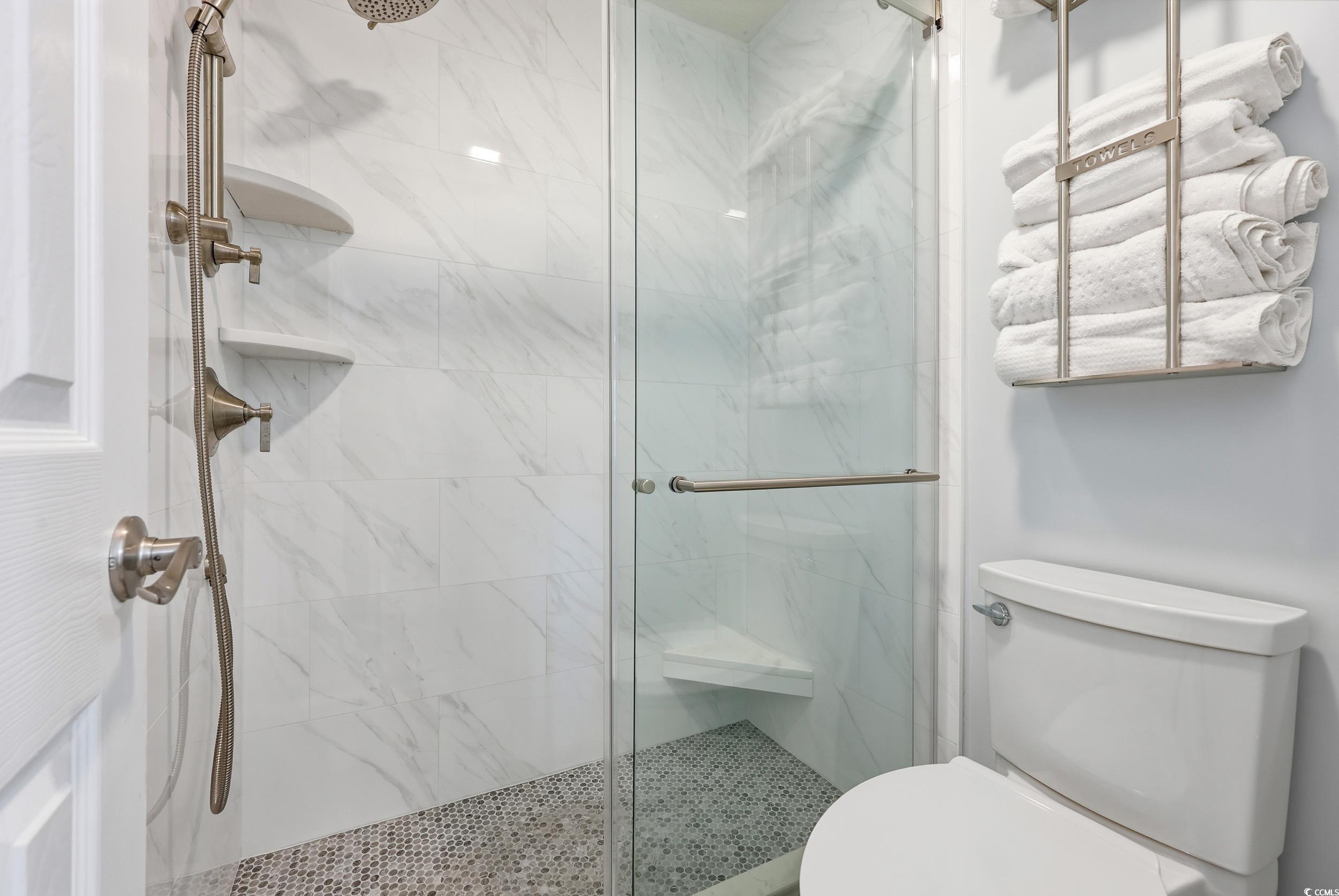 448 Pinehurst Lane, Unit 16F Pawleys Island, SC 29585 - Photo 24 of 31 Bathroom with a marble finish shower