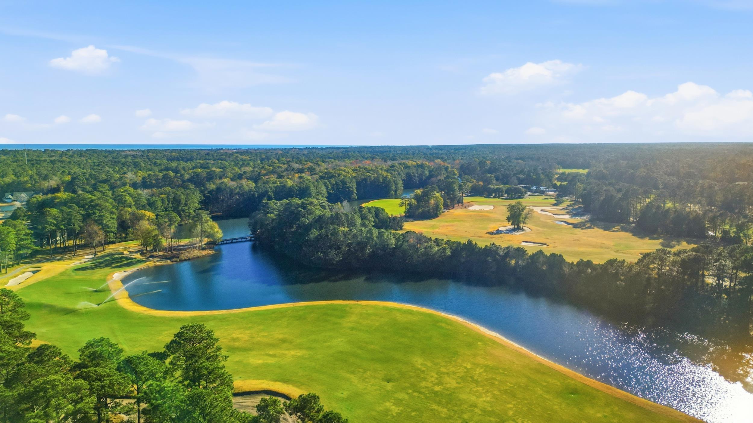 448 Pinehurst Lane, Unit 16F Pawleys Island, SC 29585 - Photo 25 of 31 Bird's eye view of a large body of water and a local golf course