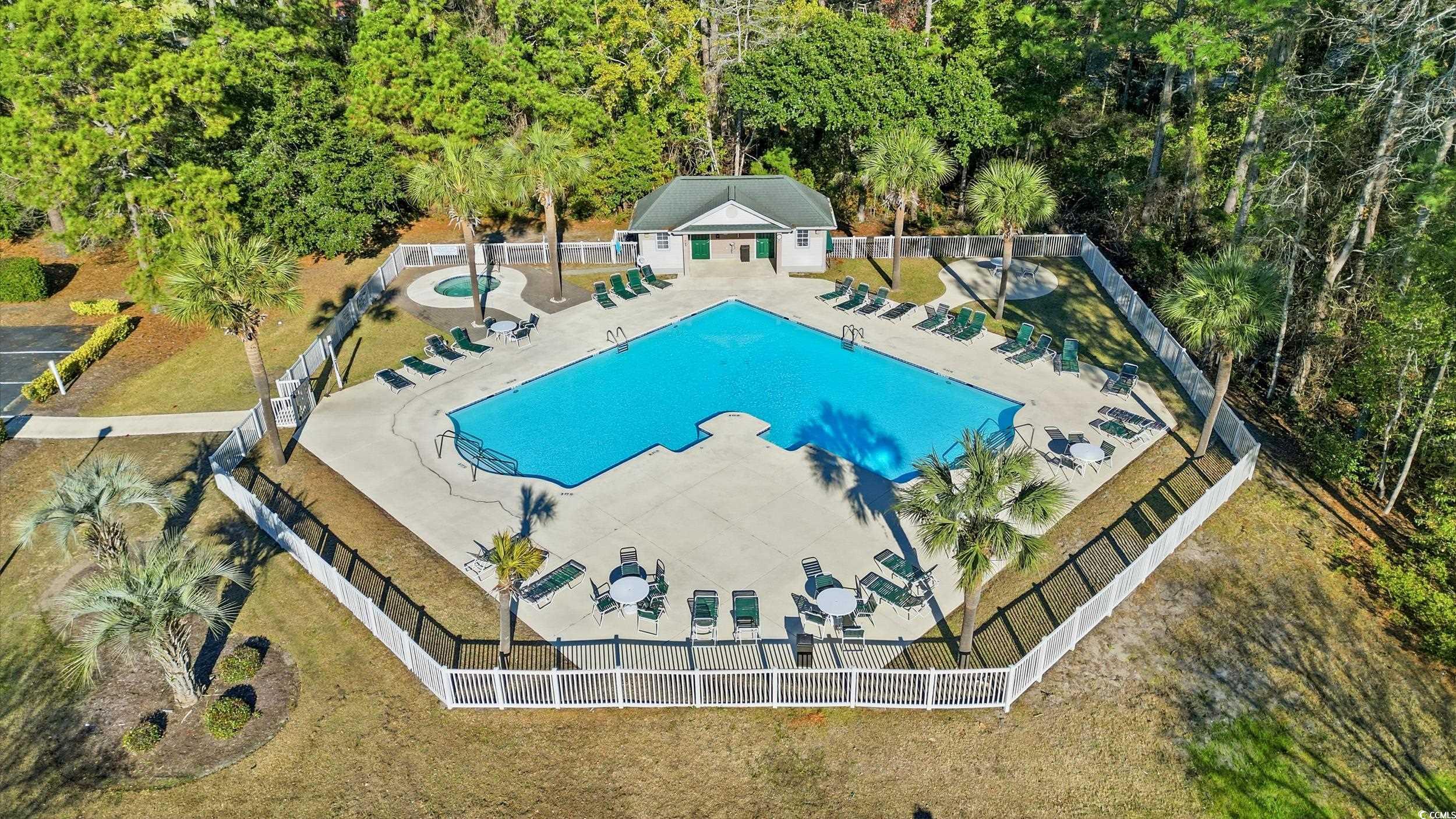 448 Pinehurst Lane, Unit 16F Pawleys Island, SC 29585 - Photo 26 of 31 Community pool featuring a patio