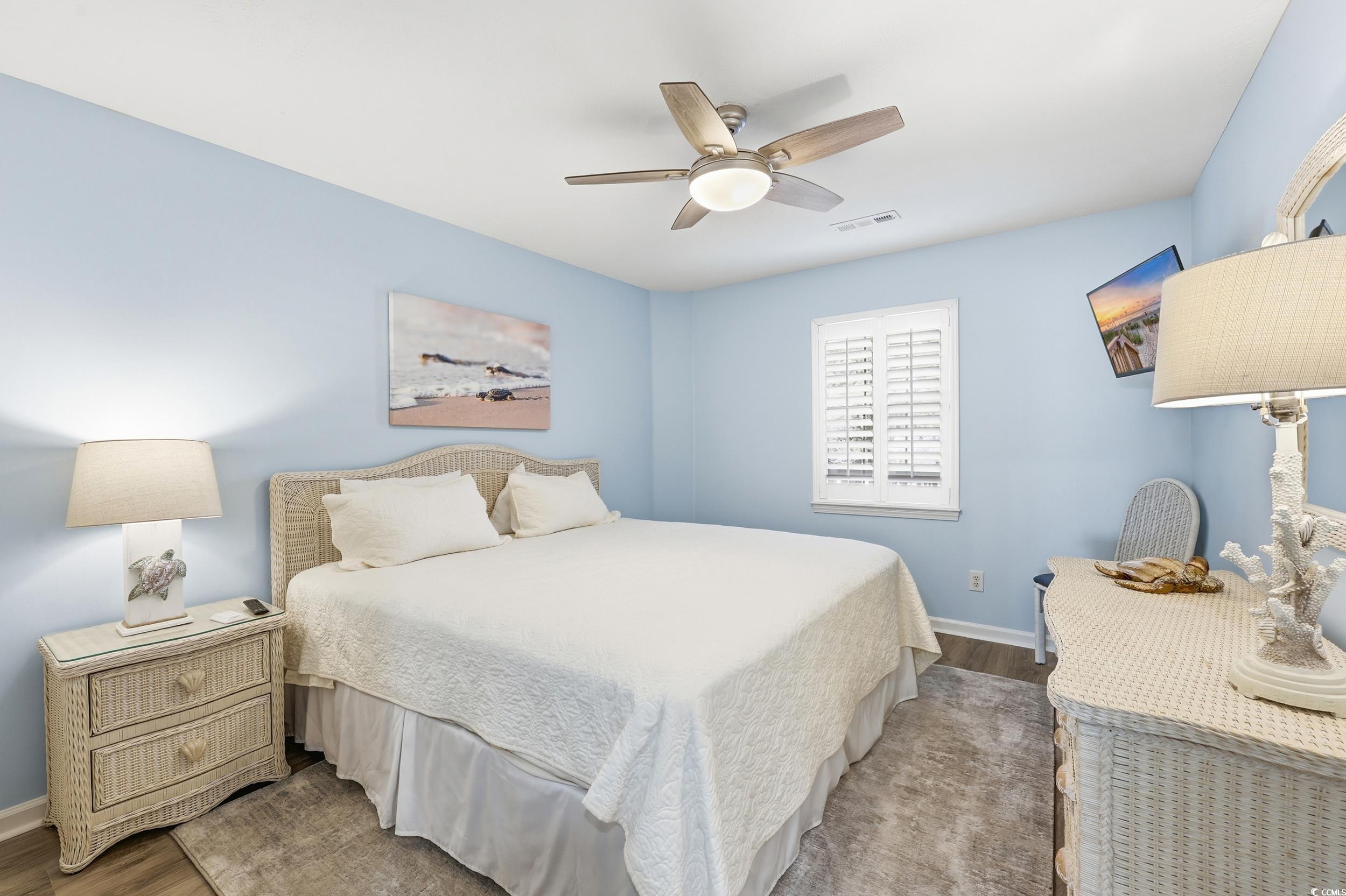 448 Pinehurst Lane, Unit 16F Pawleys Island, SC 29585 - Photo 28 of 31 Bedroom with ceiling fan and wood finished floors