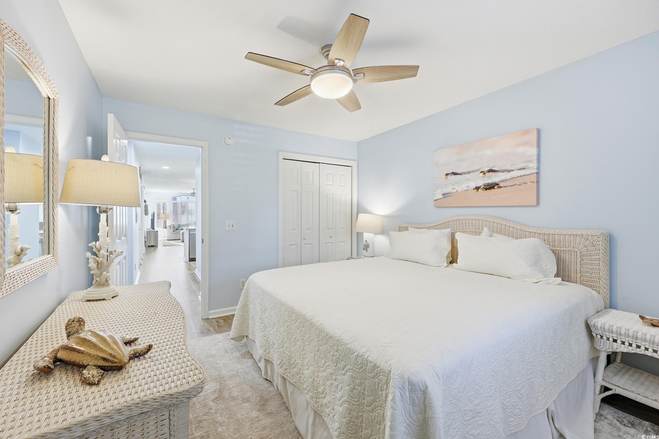 448 Pinehurst Lane, Unit 16F Pawleys Island, SC 29585 - Photo 29 of 31 Bedroom with a closet and a ceiling fan