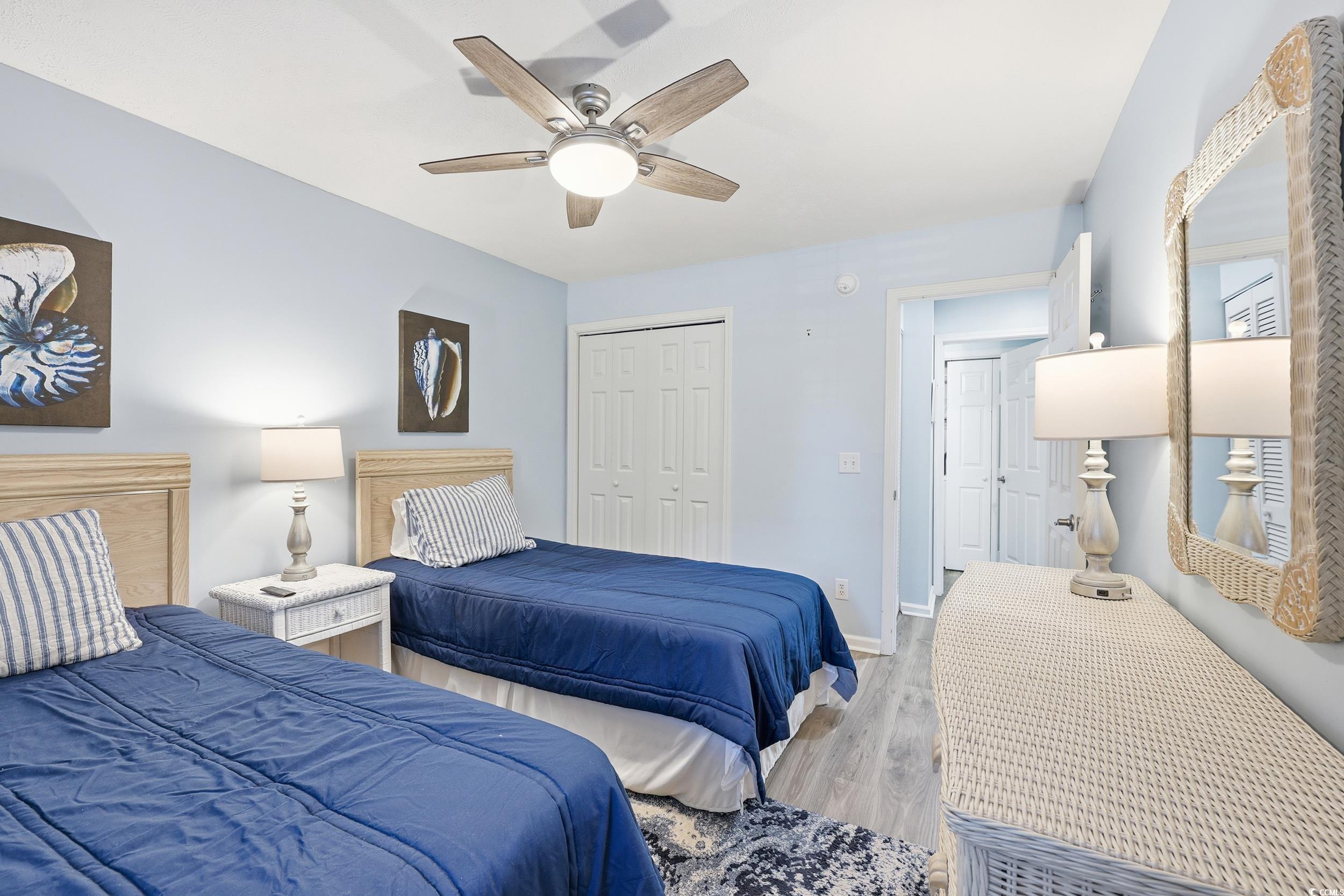 448 Pinehurst Lane, Unit 16F Pawleys Island, SC 29585 - Photo 4 of 31 Bedroom with wood finished floors, a closet, and a ceiling fan