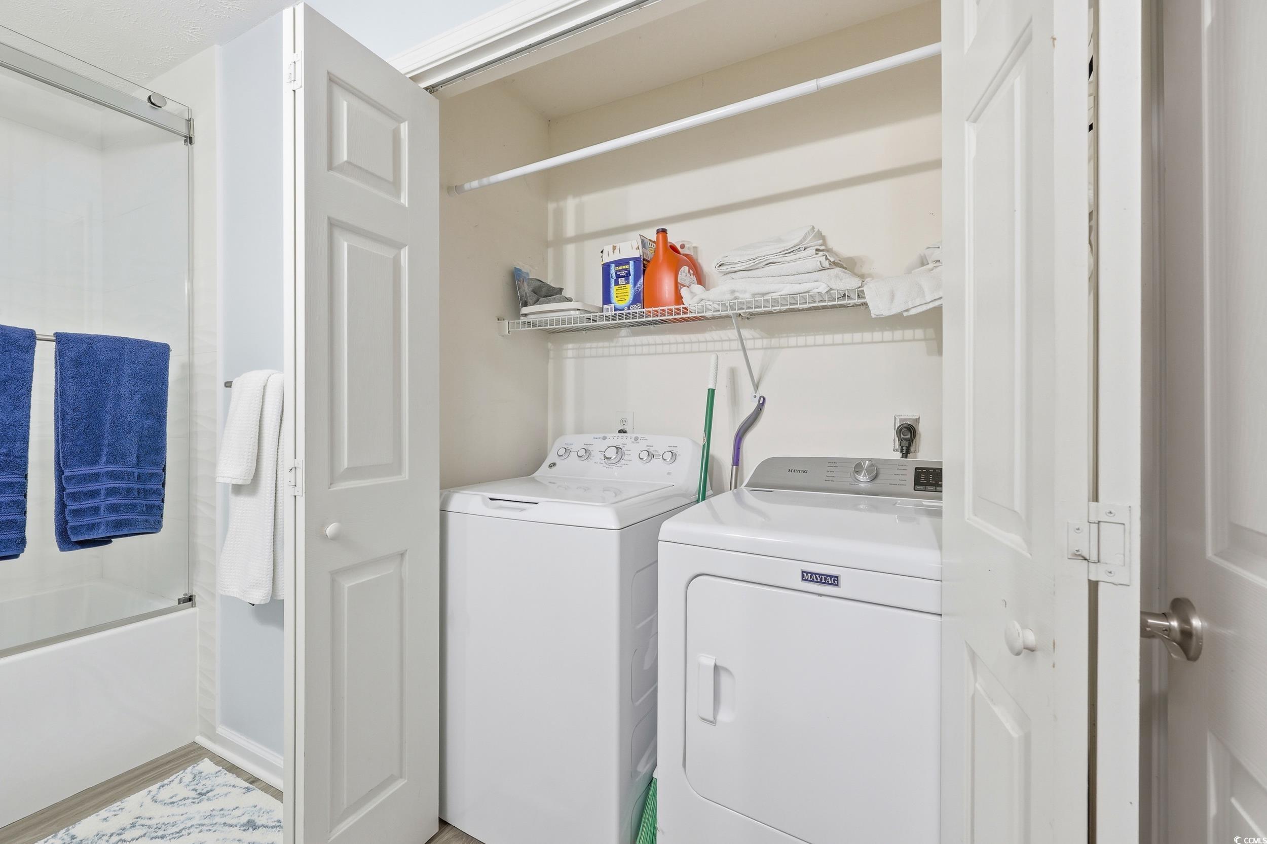 448 Pinehurst Lane, Unit 16F Pawleys Island, SC 29585 - Photo 8 of 31 Laundry area with washing machine and dryer
