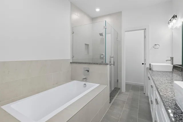 a bathroom with a bathtub and a shower