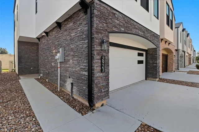 a view of a house with a door and wooden walls
