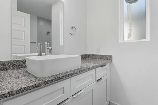 a bathroom with a sink a toilet and bathtub