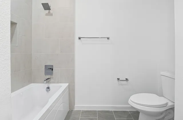 wooden floor with closet area