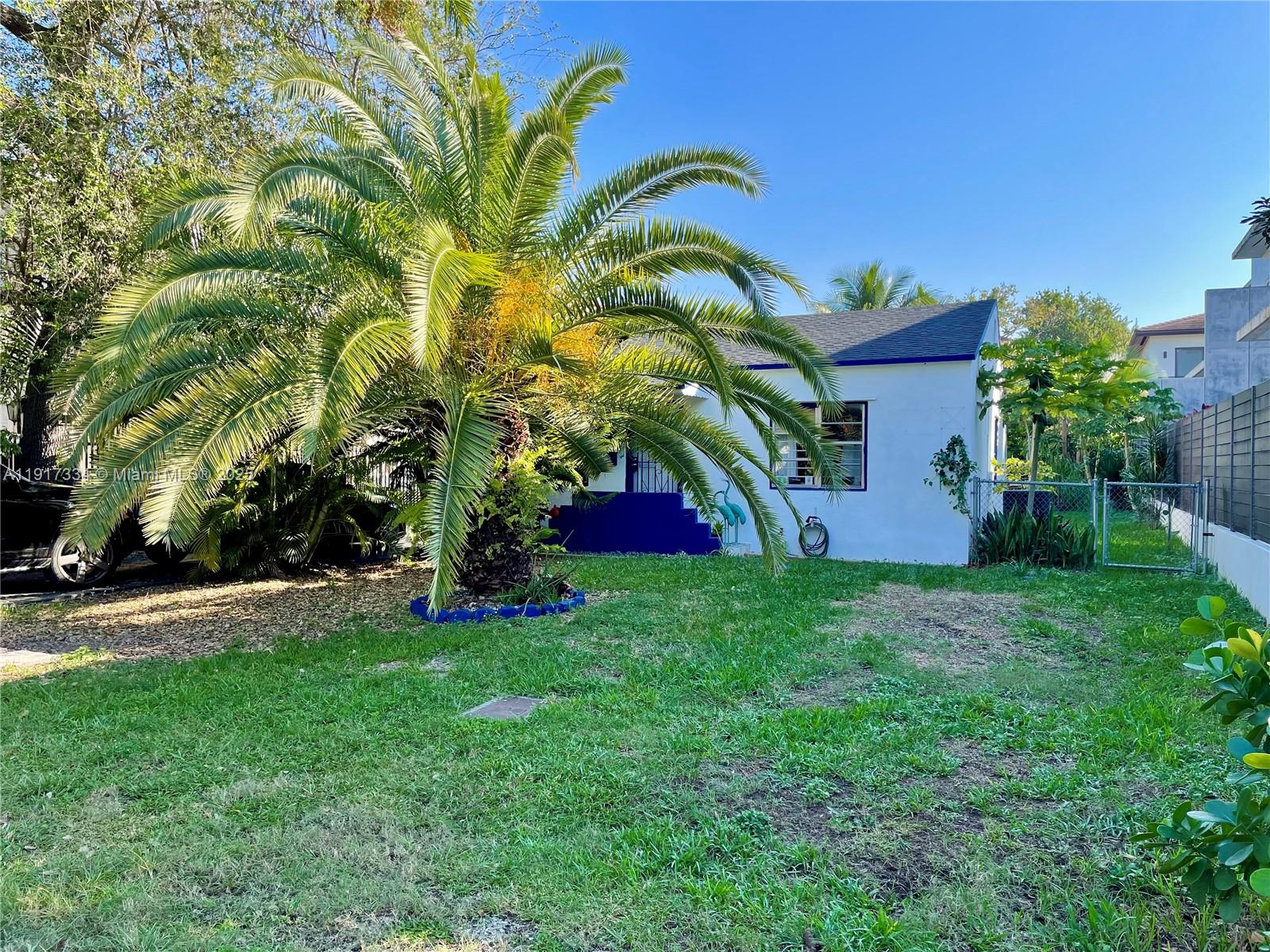 3085 Elizabeth Street, Unit 2 Miami, FL 33133 - Photo 1 of 18 a view of a garden with a building in the background