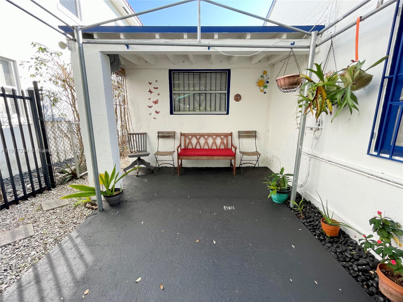 3085 Elizabeth Street, Unit 2 Miami, FL 33133 - Photo 2 of 18 a front view of a house with a potted plant