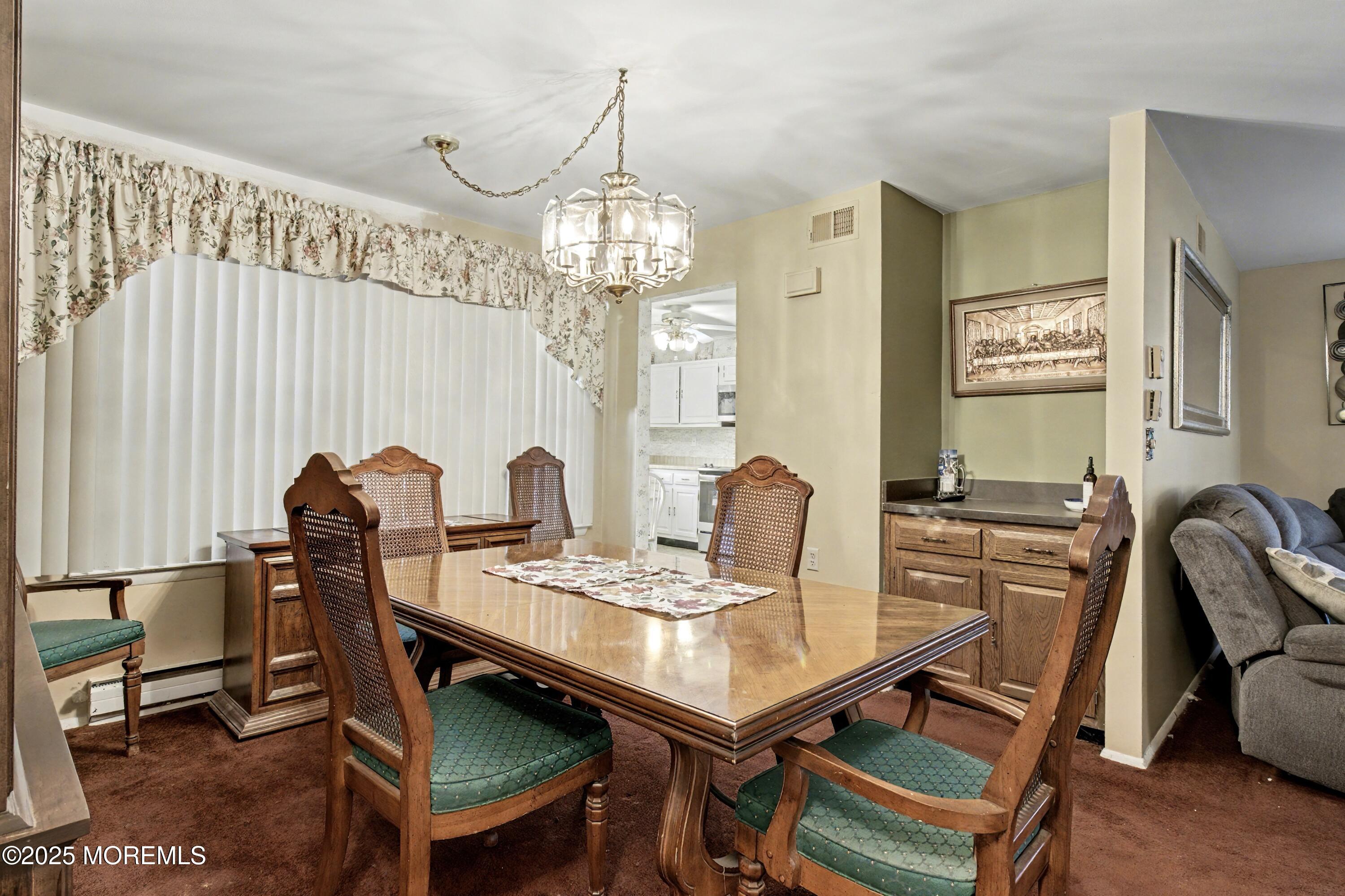 567 A Mayfair Road Manchester Township, NJ 08759 - Photo 17 of 46 a view of a dining room with furniture and chandelier
