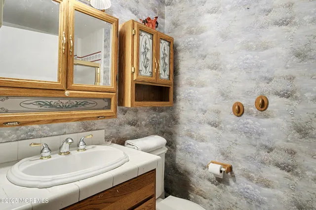 a bathroom with a glass shower door