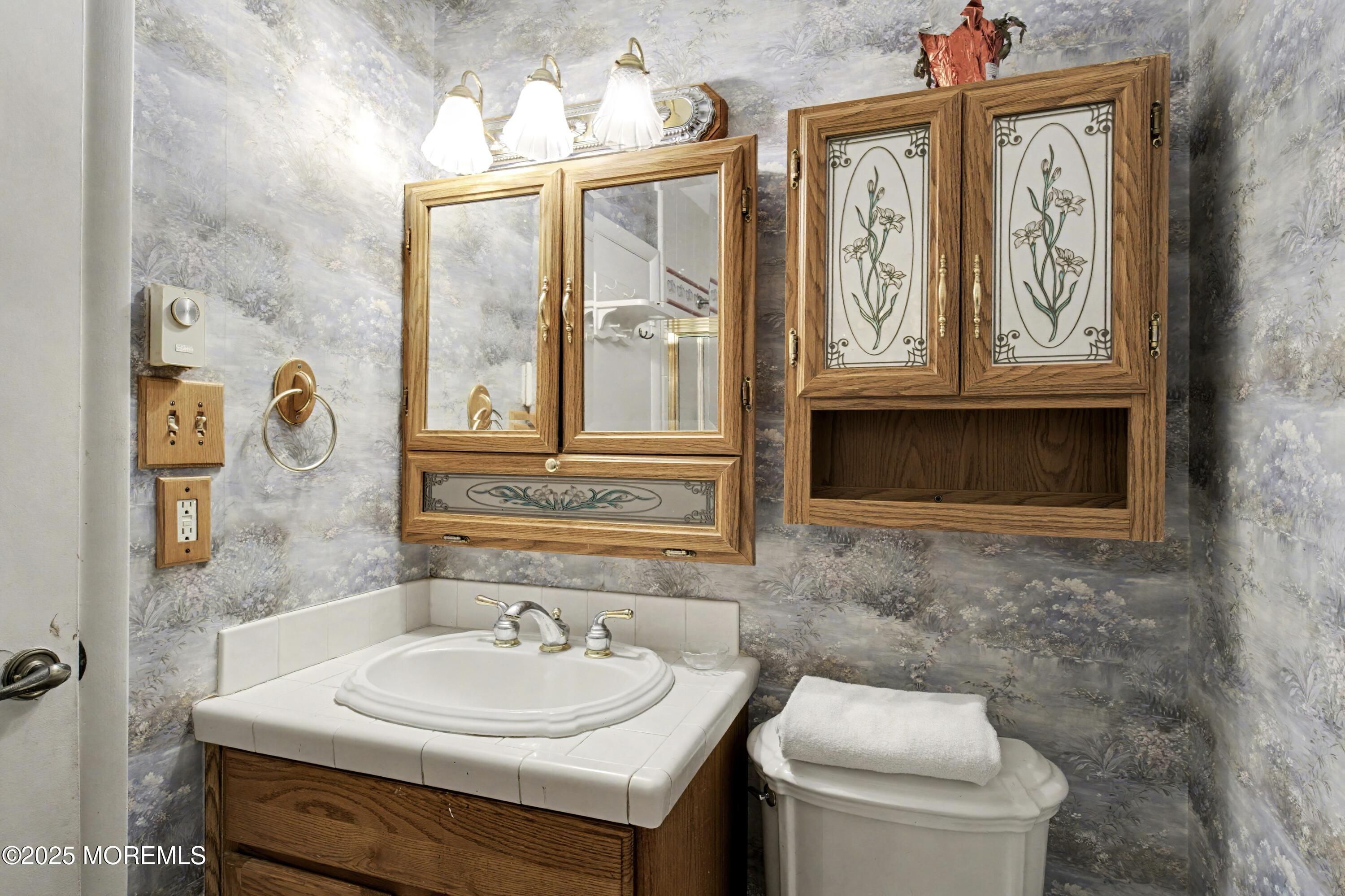 567 A Mayfair Road Manchester Township, NJ 08759 - Photo 21 of 46 a bathroom with a sink and a toilet