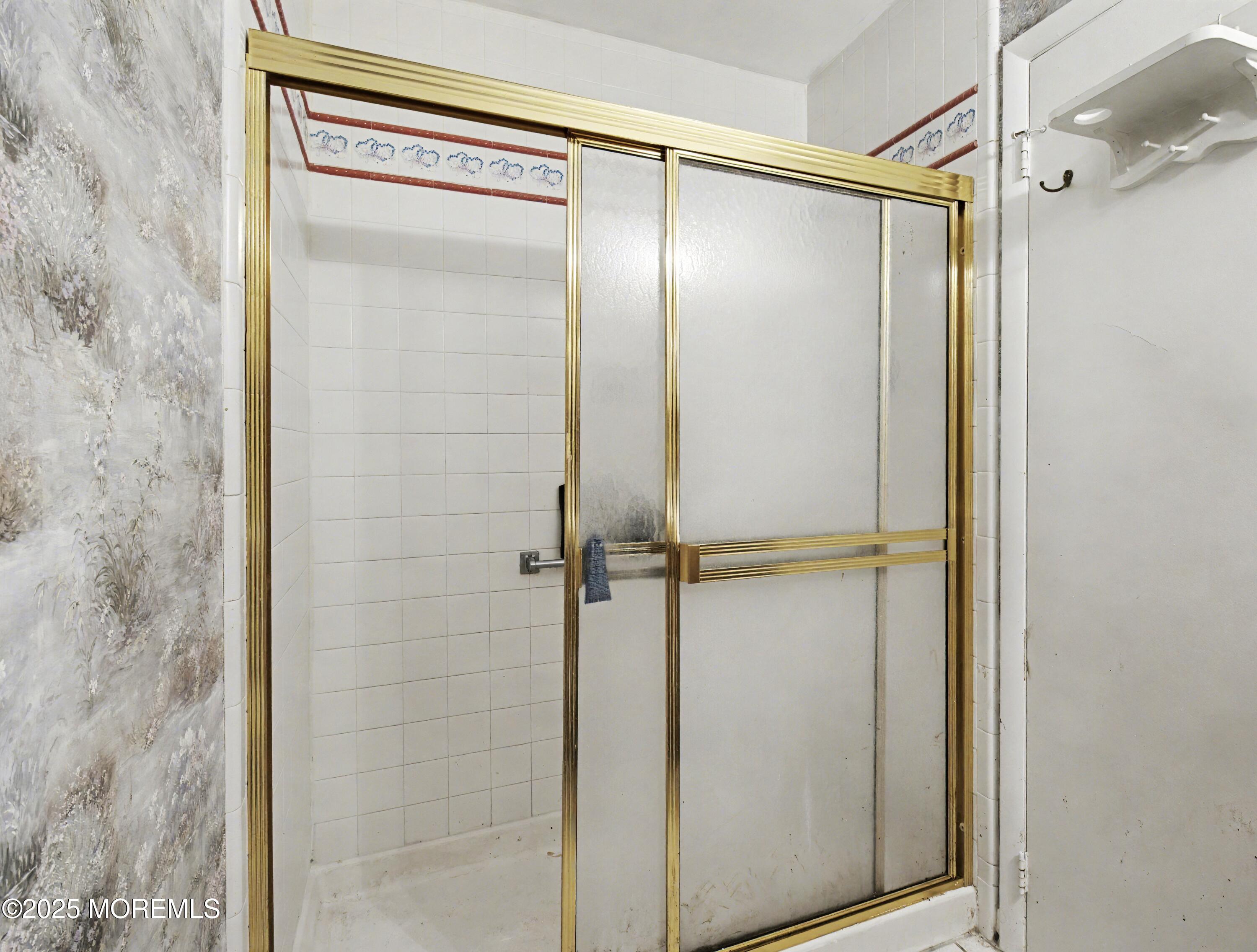 567 A Mayfair Road Manchester Township, NJ 08759 - Photo 22 of 46 a bathroom with a glass shower door