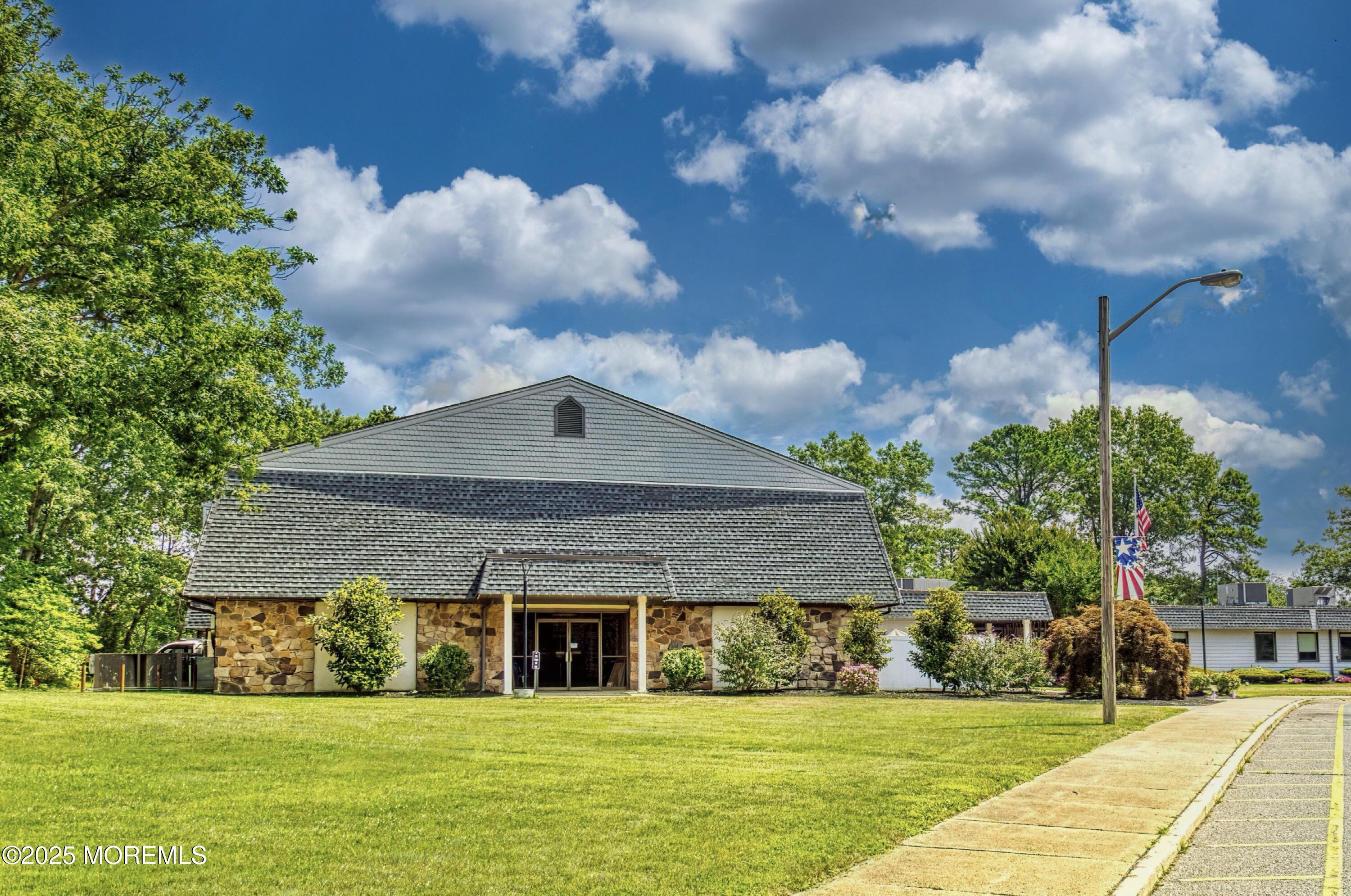 567 A Mayfair Road Manchester Township, NJ 08759 - Photo 26 of 46 a front view of a house with a yard