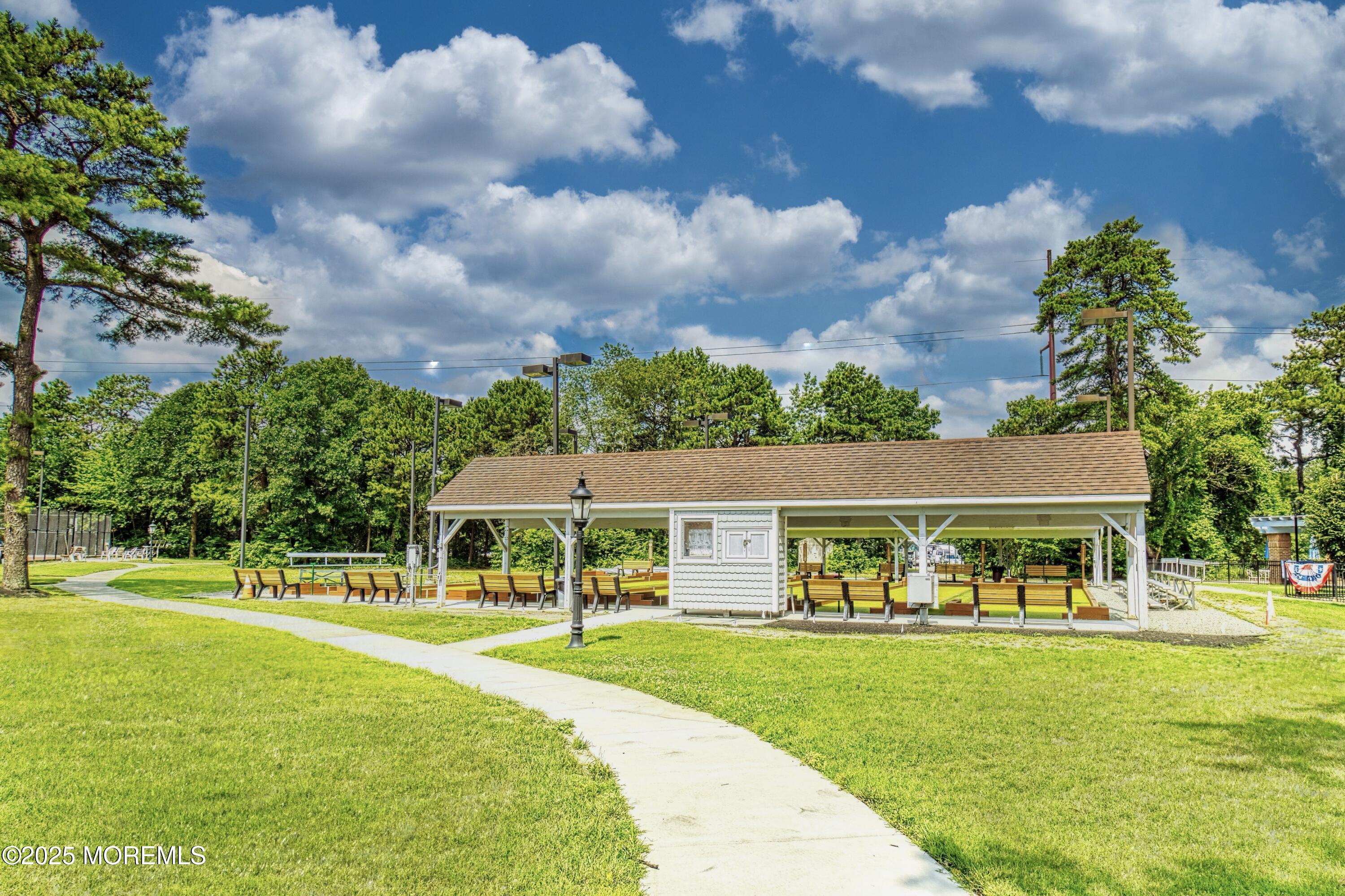 567 A Mayfair Road Manchester Township, NJ 08759 - Photo 27 of 46 a view of house in front of a big yard with large trees