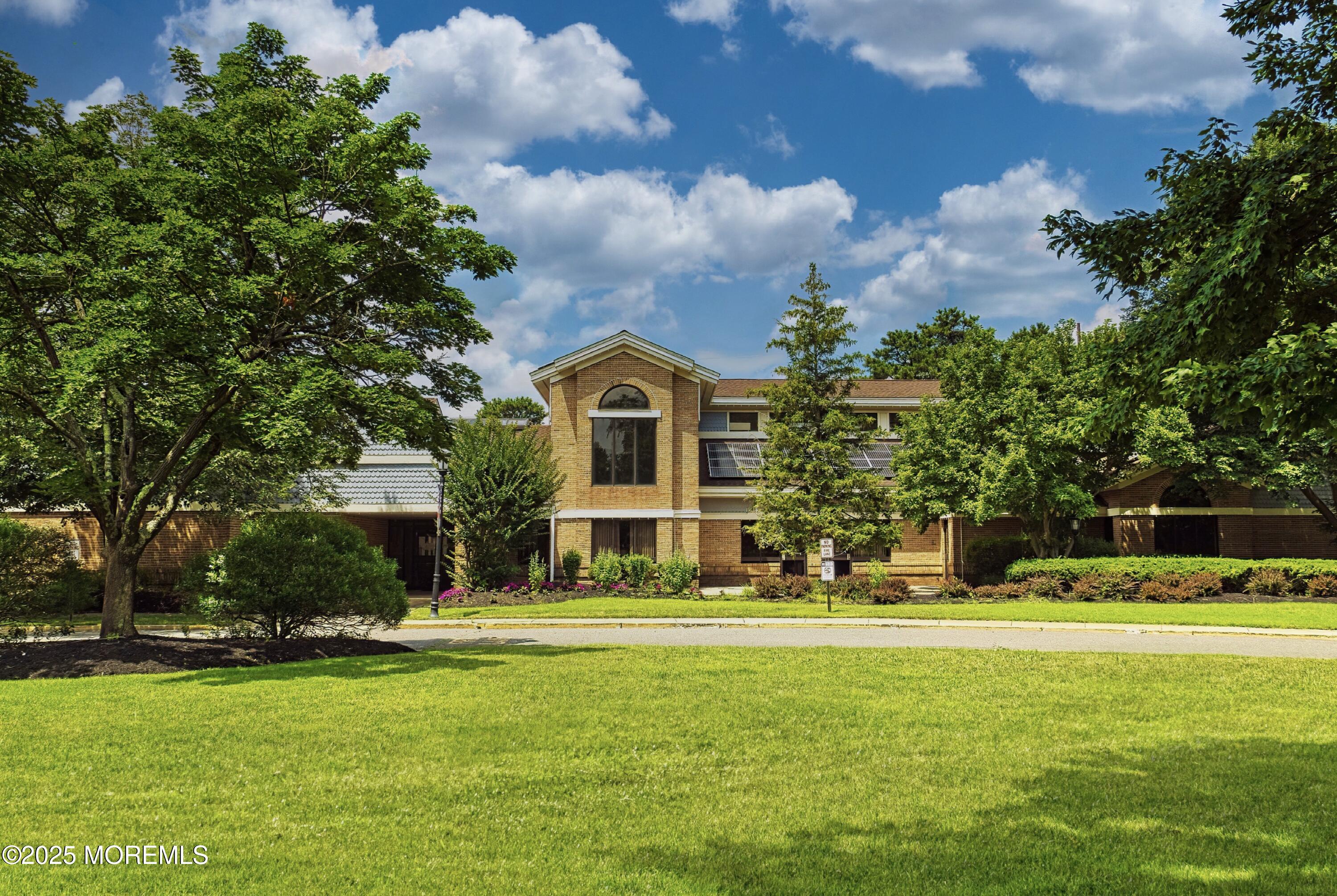 567 A Mayfair Road Manchester Township, NJ 08759 - Photo 30 of 46 a front view of house with yard and green space