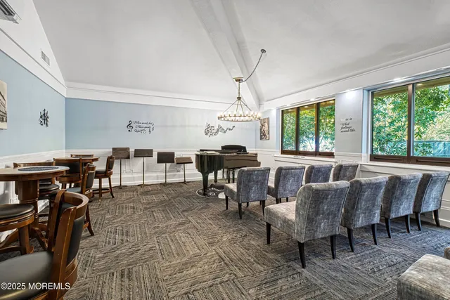 a living room with lots of furniture and a wooden floor