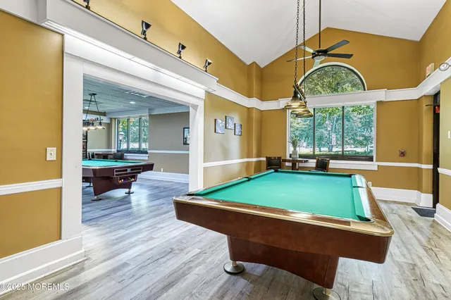 a kitchen with a dining table and chairs