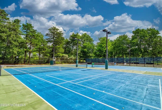 a view of green field with sitting area