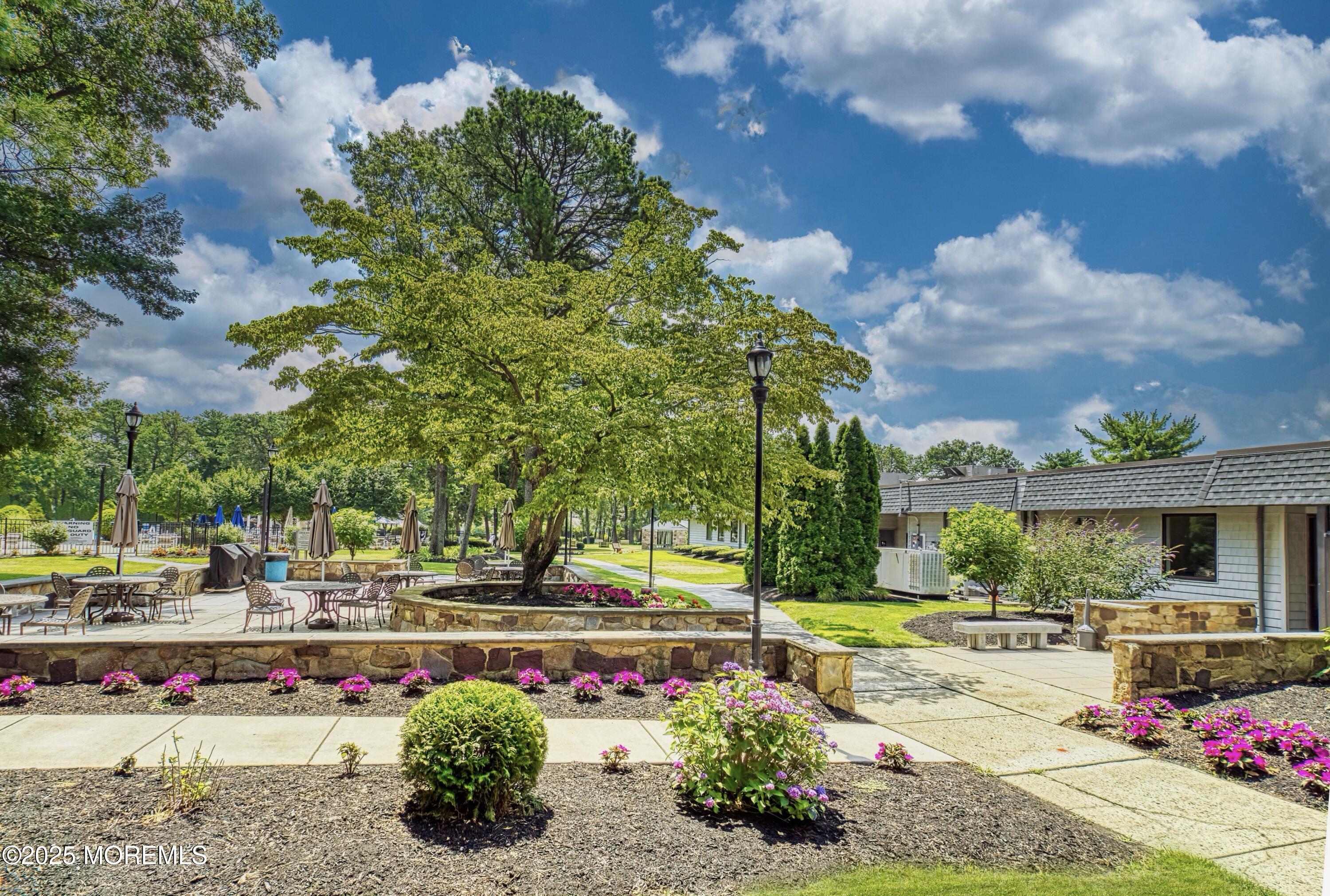 567 A Mayfair Road Manchester Township, NJ 08759 - Photo 44 of 46 a view of green field with sitting area