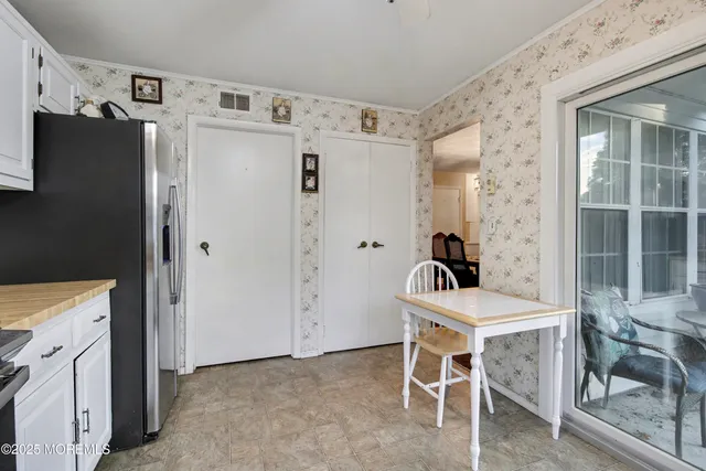 a living room with furniture a rug and a window