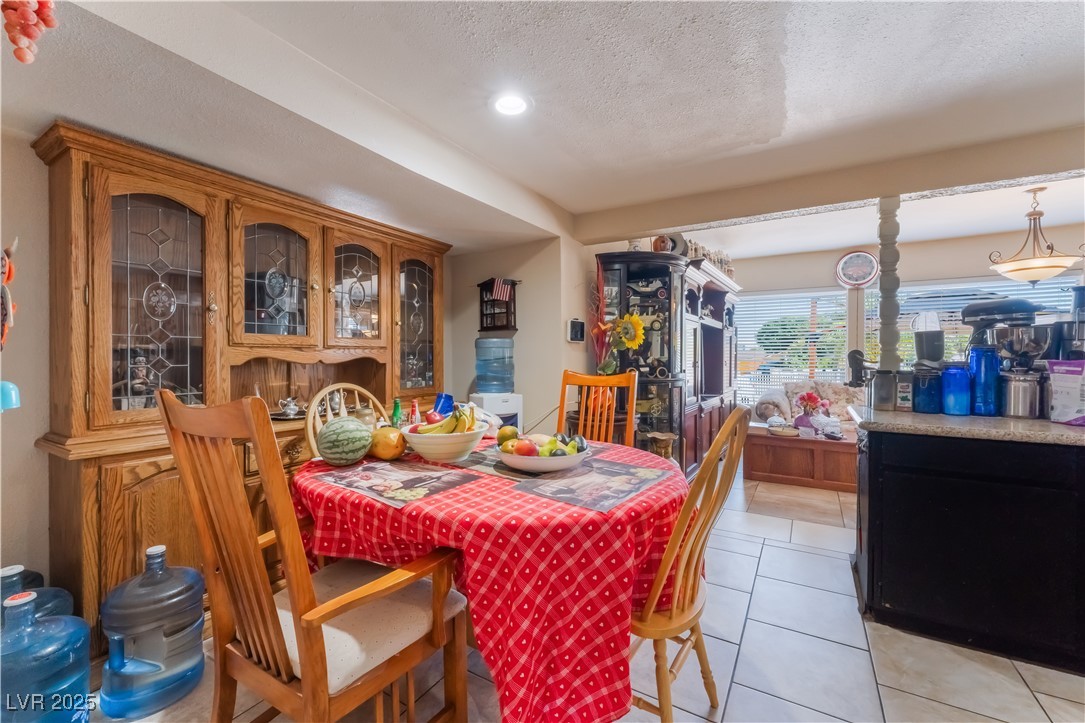 1908 Ardmore Street Las Vegas, NV 89104 - Photo 11 of 29 Dining area with light tile patterned floors, a textured ceiling, and recessed lighting