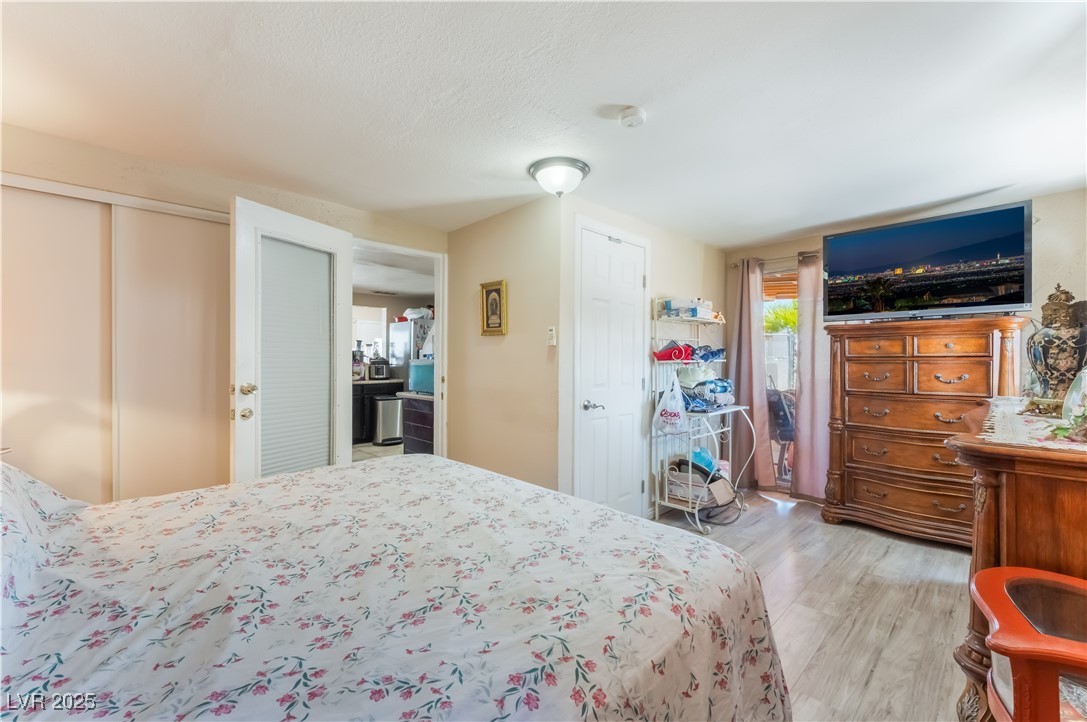 1908 Ardmore Street Las Vegas, NV 89104 - Photo 19 of 29 Bedroom with light wood-type flooring and a closet