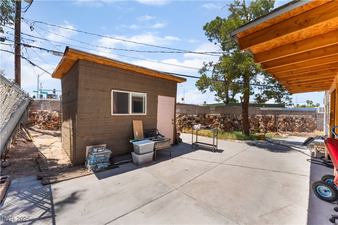 1908 Ardmore Street Las Vegas, NV 89104 - Photo 25 of 29 Fenced backyard with a patio area and an outdoor structure