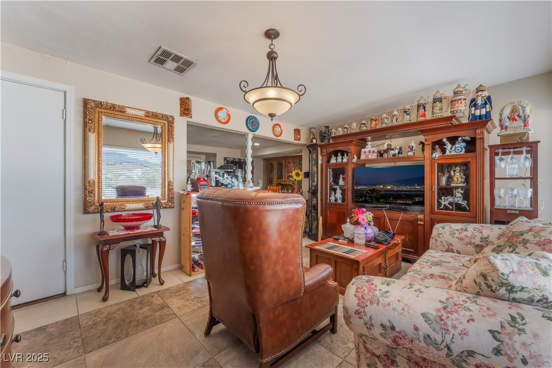 1908 Ardmore Street Las Vegas, NV 89104 - Photo 7 of 29 Living room featuring light tile patterned floors