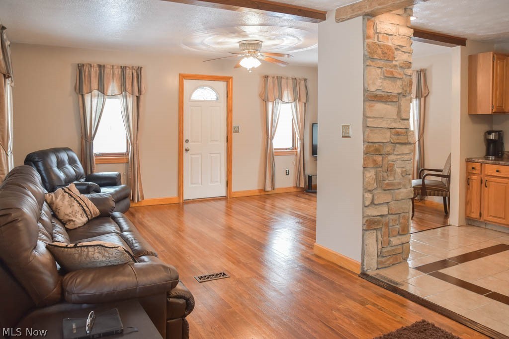973 Mishler Road Mogadore, OH 44260 - Photo 20 of 20 Open floor plan with wood flooring in the living and dining room.