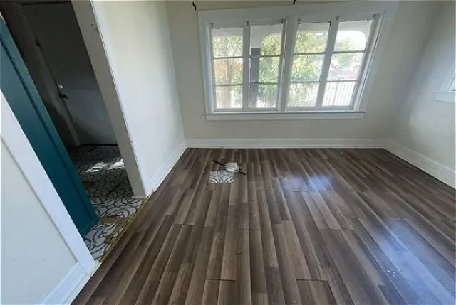 a view of wooden floor in an empty room