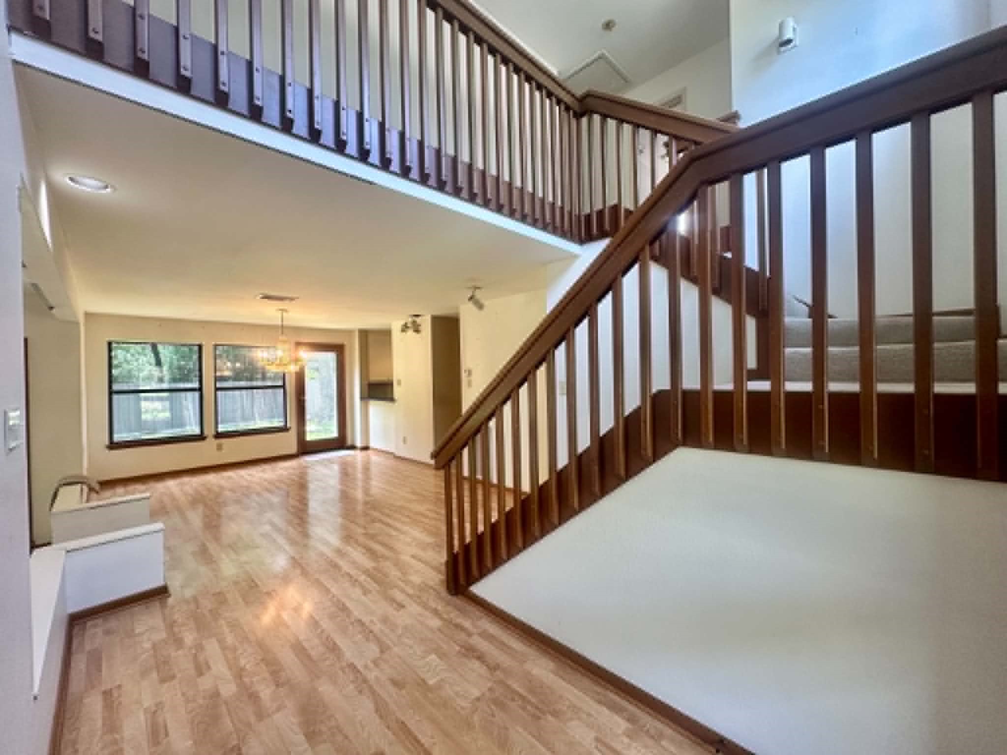 51 Split Rock Road The Woodlands, TX 77381 - Photo 18 of 18 Unmatched potential! A dramatic two story welcomes you into a vast sundrenched open floor plan. Boasting spectacular architectural bones, high ceilings, and flexible layout, this space is equally ready to be cherished as a retro time capsule or transformed into a modern masterpiece.