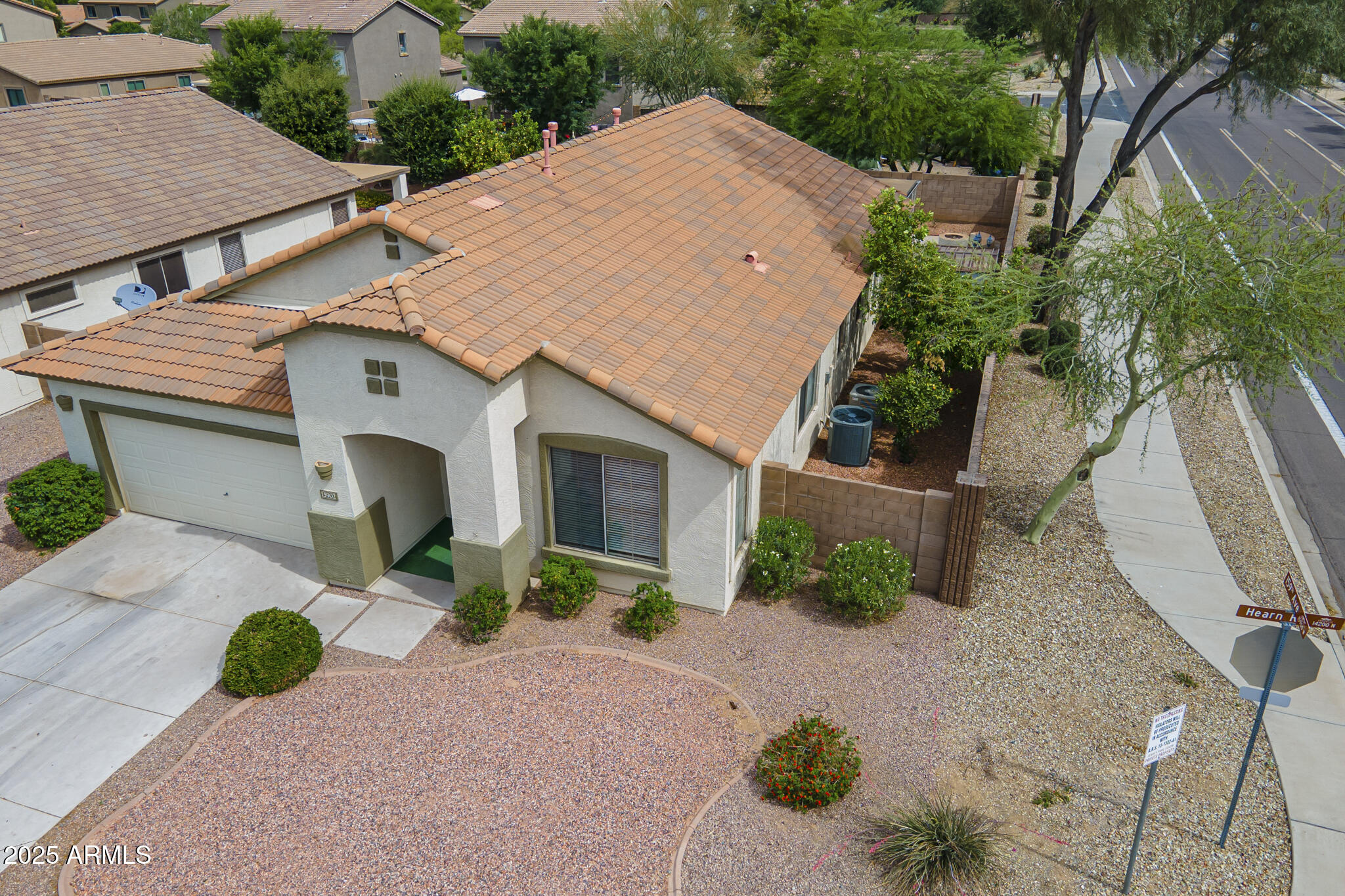 15902 West Hearn Road Surprise, AZ 85379 - Photo 2 of 73 a aerial view of a house with a yard and potted plants