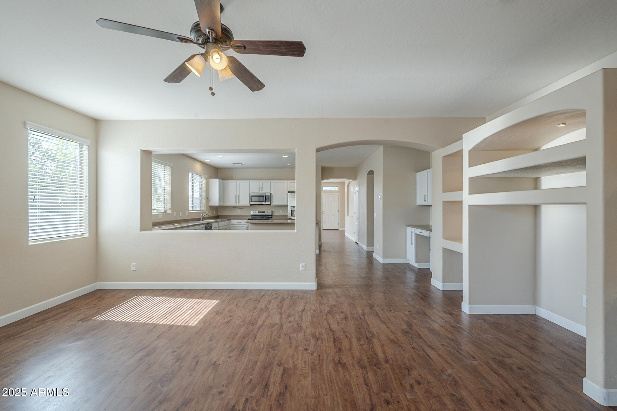 15902 West Hearn Road Surprise, AZ 85379 - Photo 42 of 73 a view of empty room with wooden floor and window