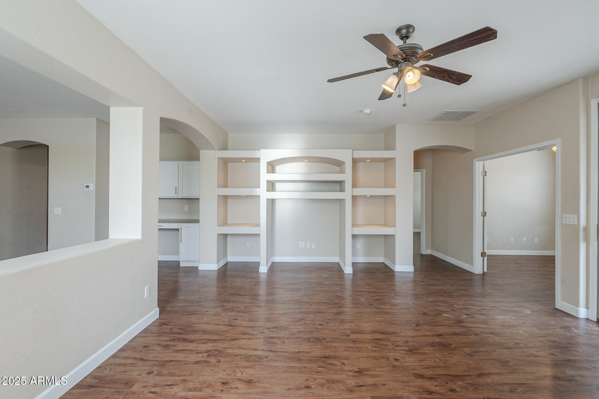 15902 West Hearn Road Surprise, AZ 85379 - Photo 43 of 73 a view of a livingroom with a furniture wooden floor and a ceiling fan