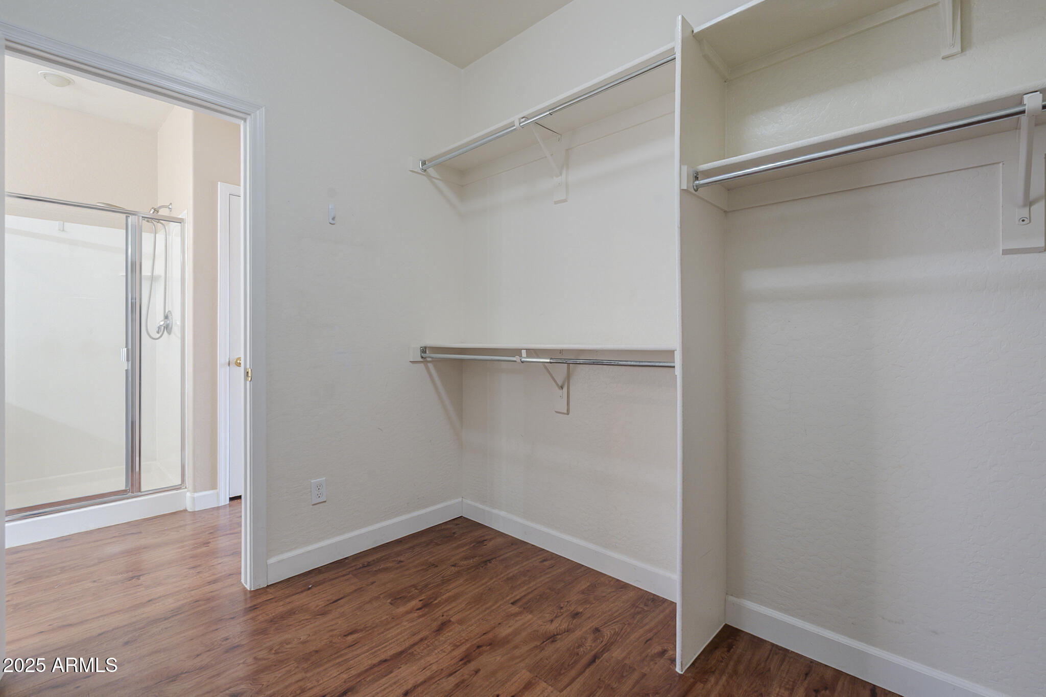 15902 West Hearn Road Surprise, AZ 85379 - Photo 52 of 73 a view of an empty room with wooden floor