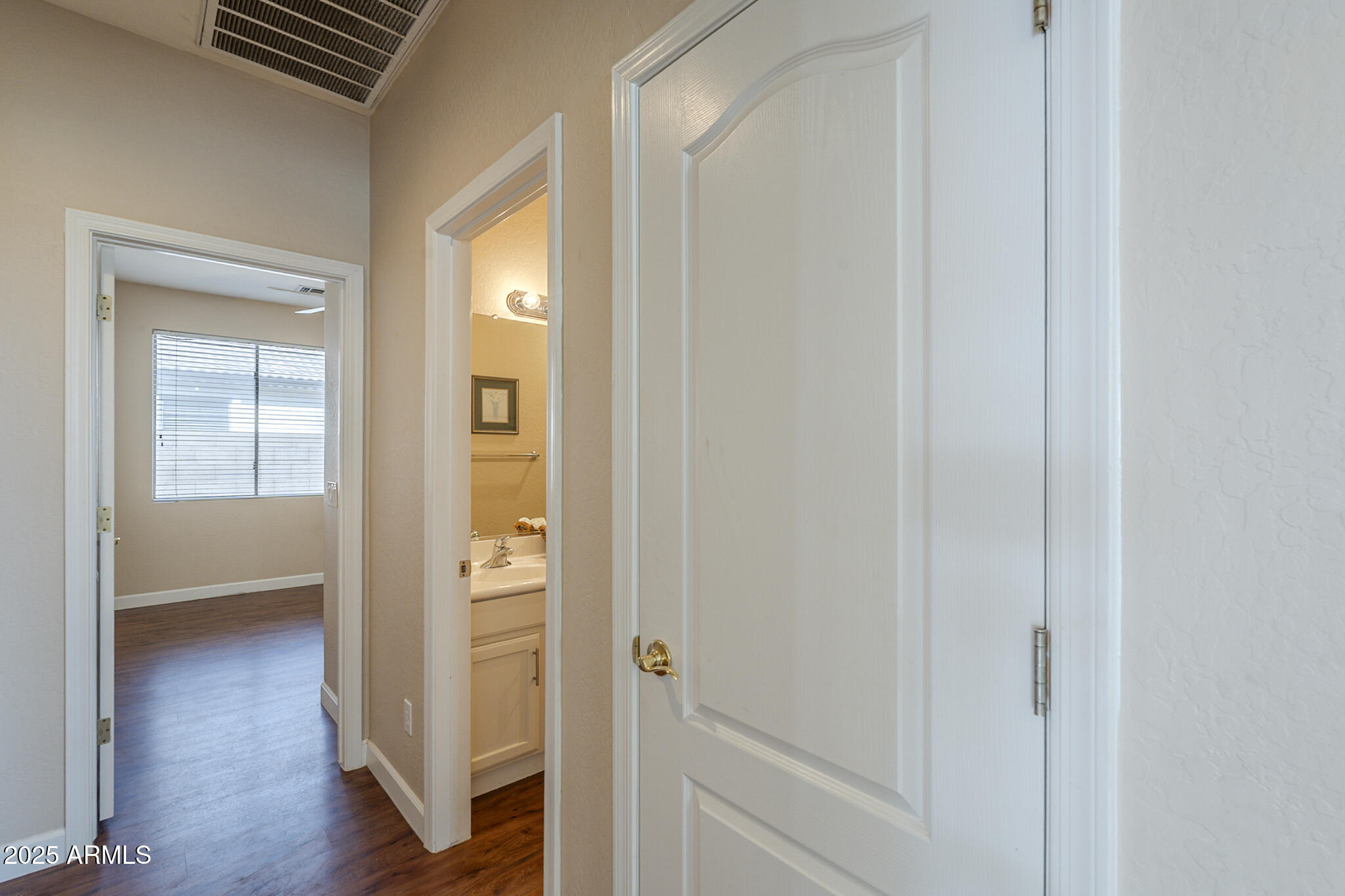 15902 West Hearn Road Surprise, AZ 85379 - Photo 54 of 73 a view of a hallway with wooden floor and closet