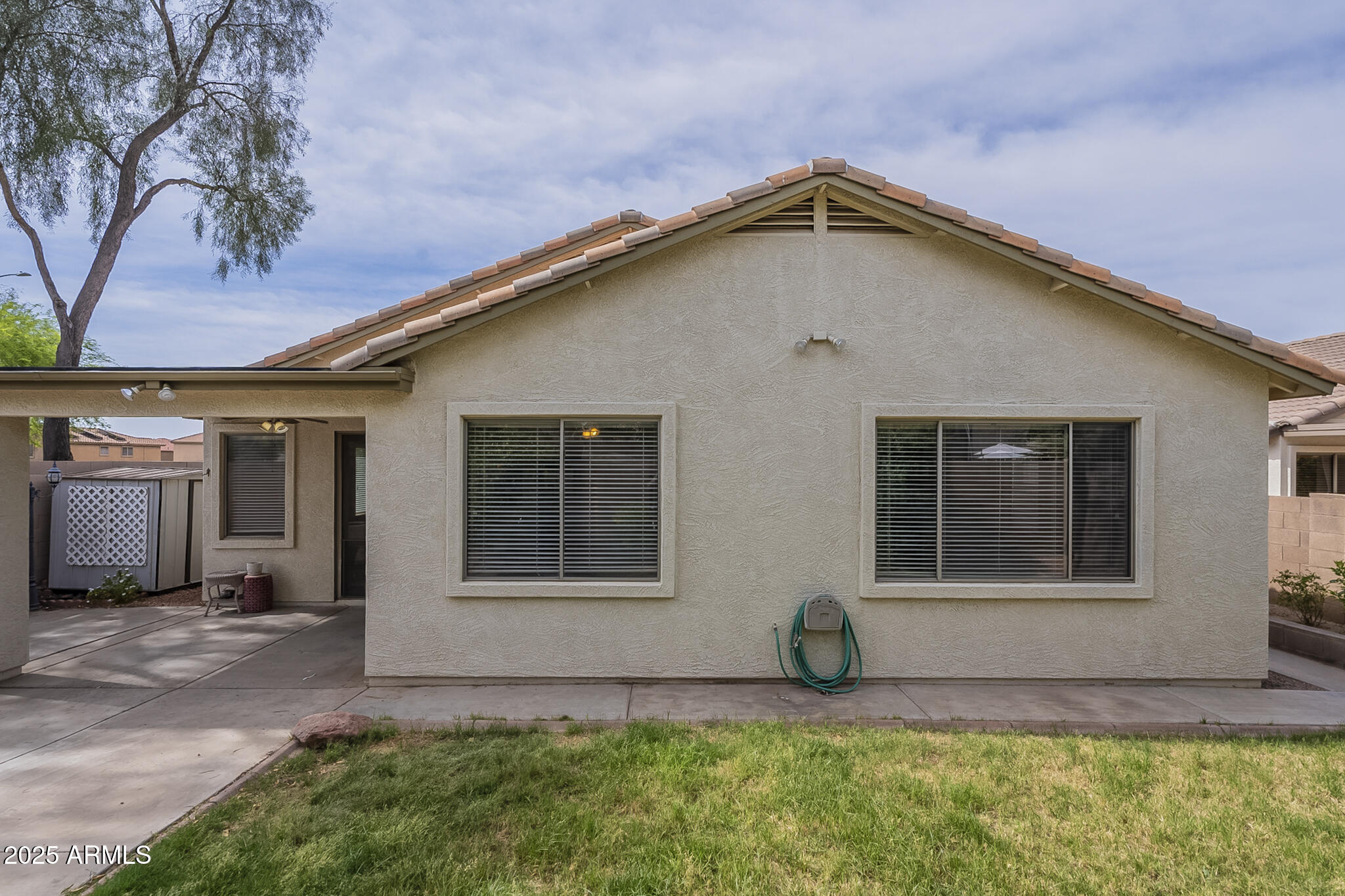 15902 West Hearn Road Surprise, AZ 85379 - Photo 67 of 73 a front view of a house with a yard