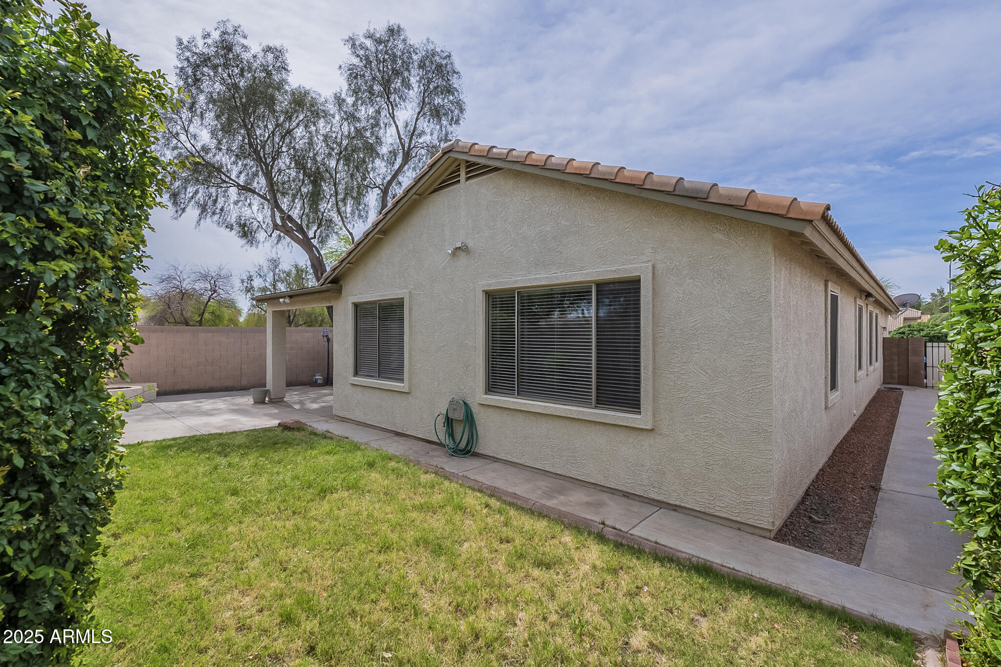 15902 West Hearn Road Surprise, AZ 85379 - Photo 68 of 73 a backyard of a house with yard and outdoor seating