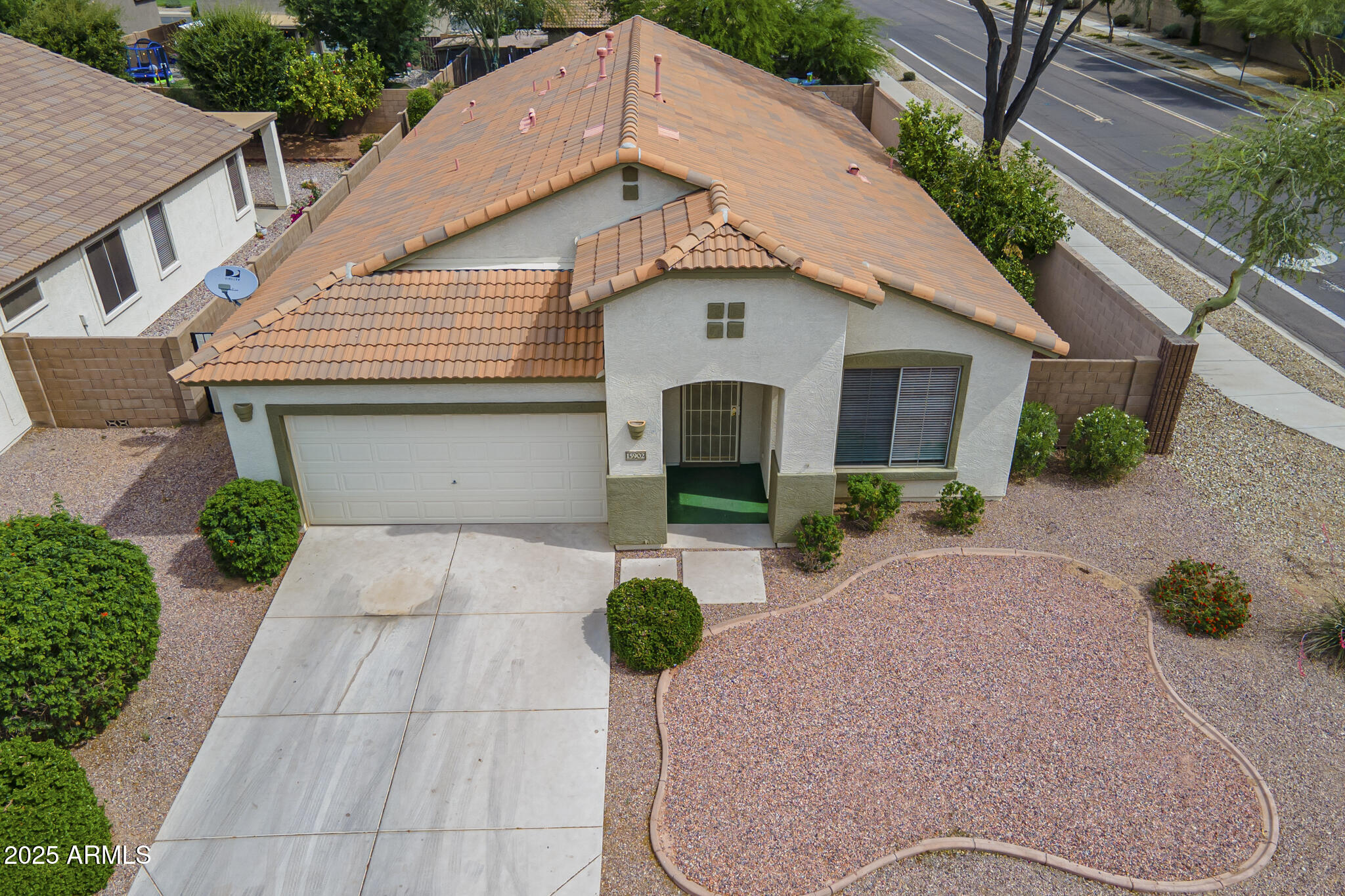 15902 West Hearn Road Surprise, AZ 85379 - Photo 70 of 73 a view of a white house with potted plants