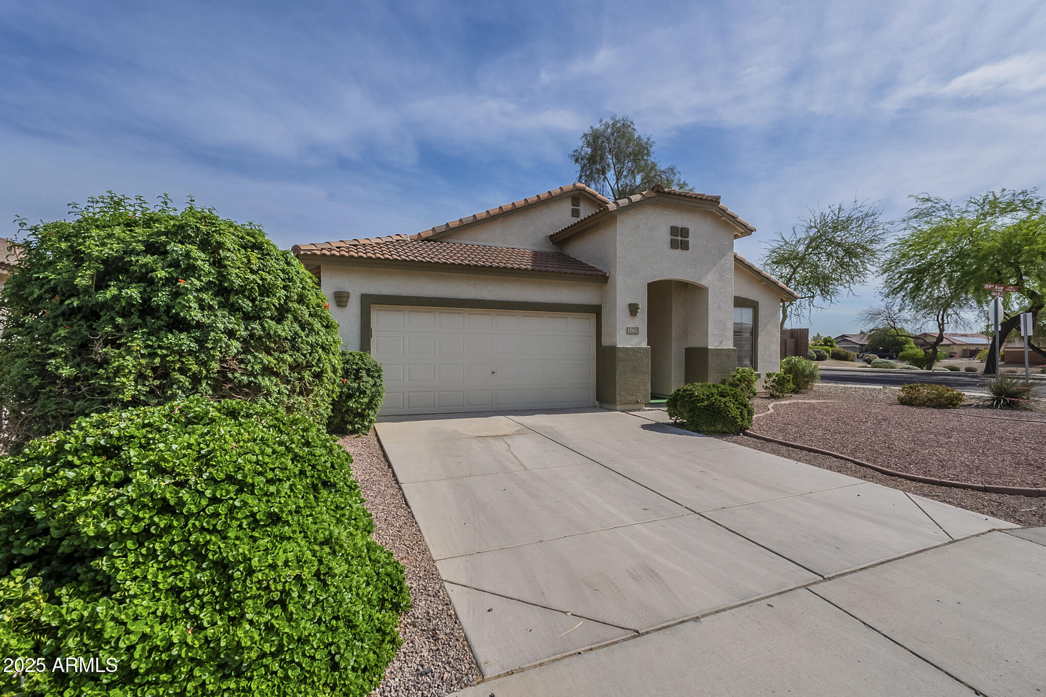 15902 West Hearn Road Surprise, AZ 85379 - Photo 71 of 73 a front view of a house with a garden