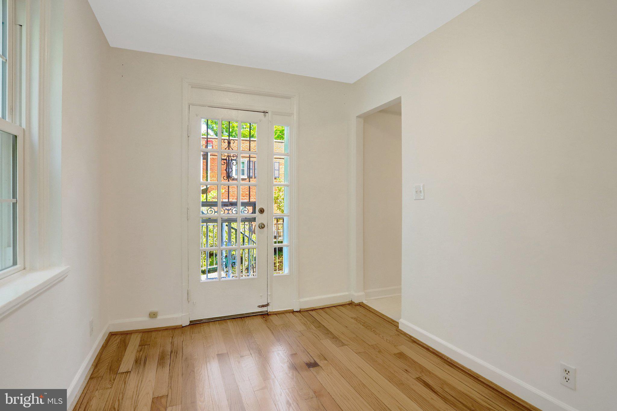 4837 27th Road South Arlington, VA 22206 - Photo 11 of 34 an empty room with wooden floor and windows
