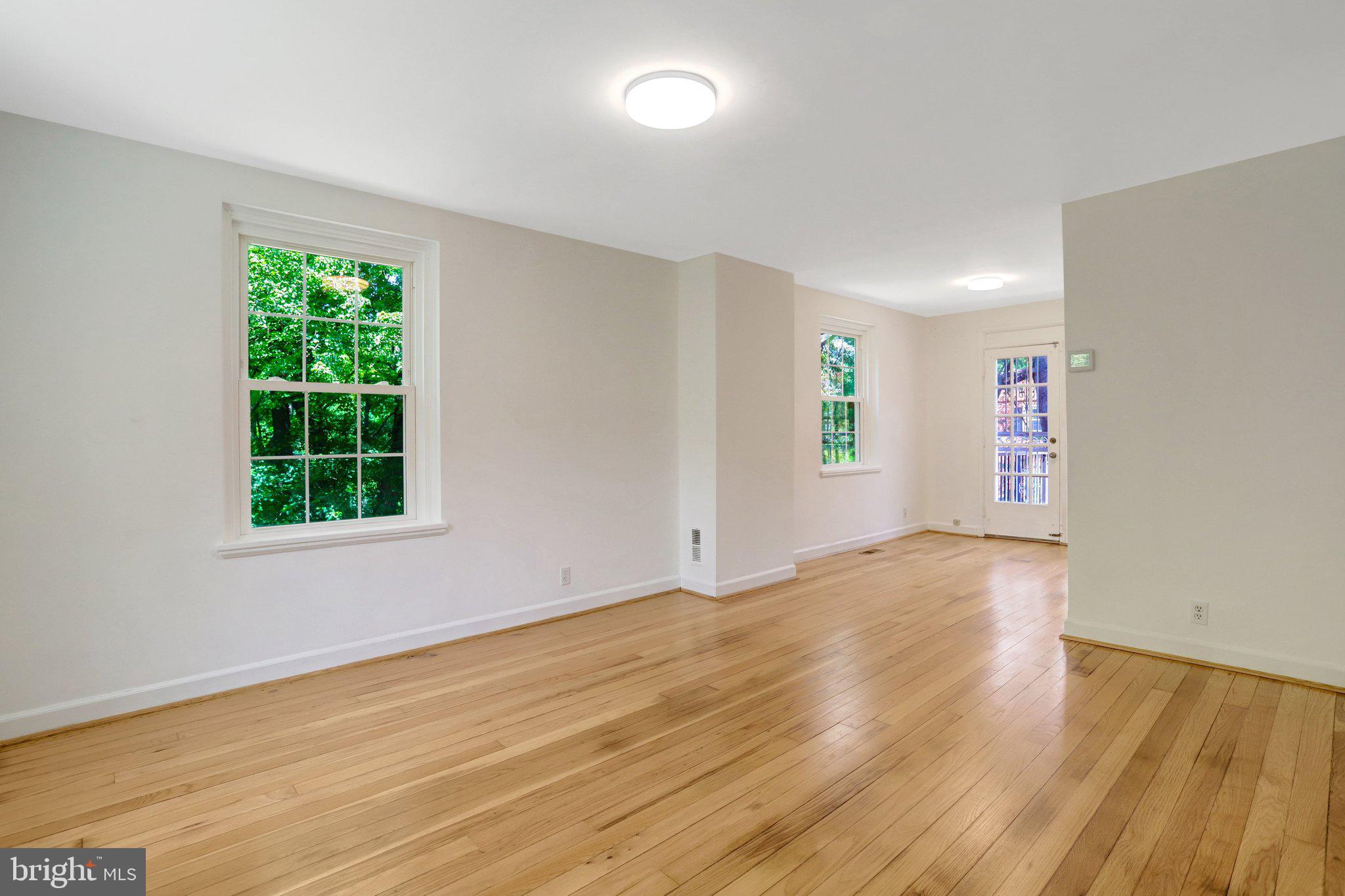 4837 27th Road South Arlington, VA 22206 - Photo 12 of 34 a view of an empty room with wooden floor and a window