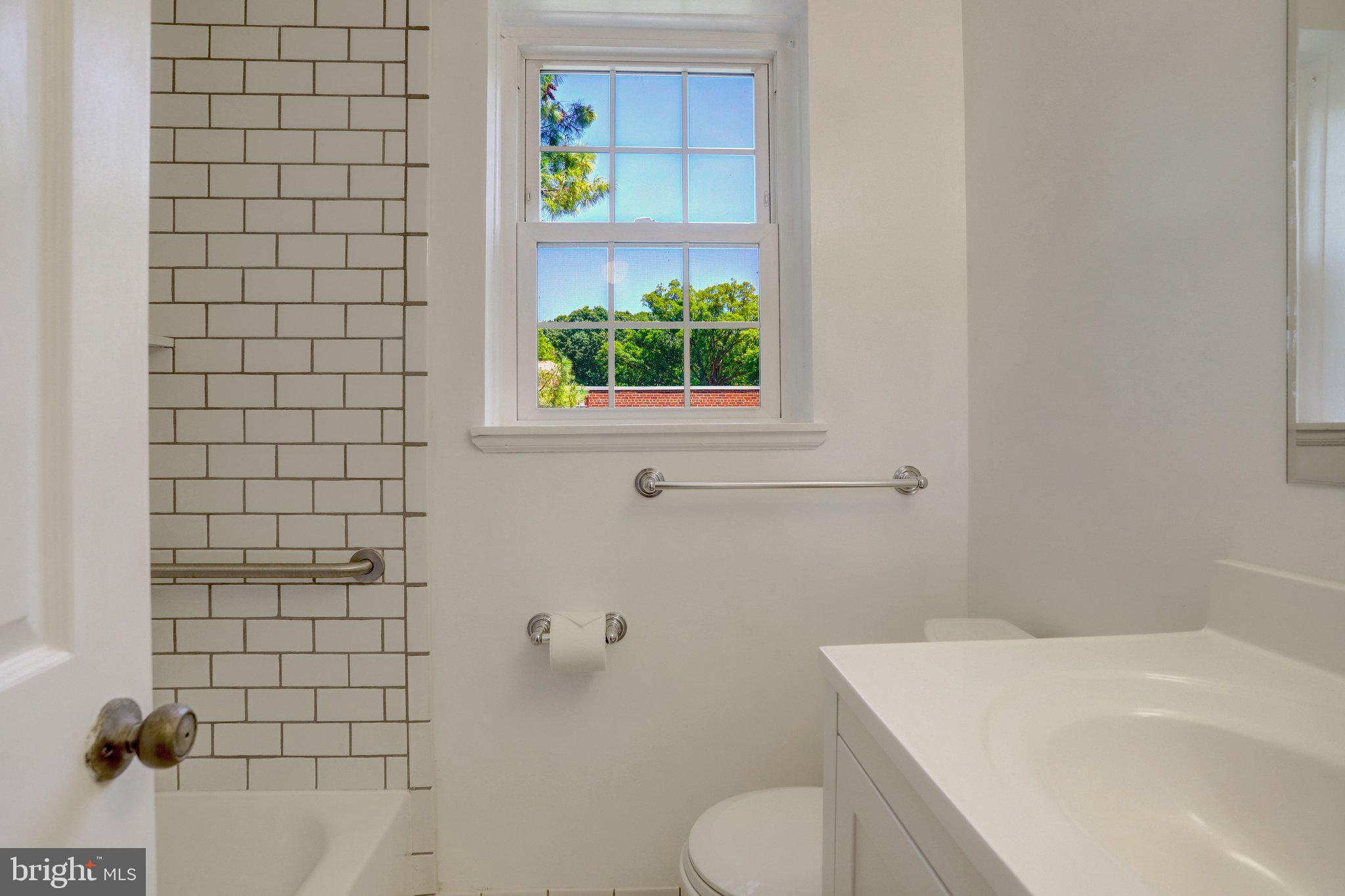4837 27th Road South Arlington, VA 22206 - Photo 18 of 34 a bathroom with a sink toilet and shower