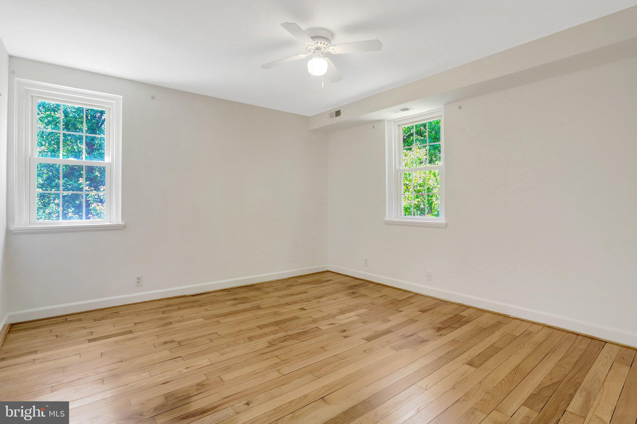 4837 27th Road South Arlington, VA 22206 - Photo 24 of 34 a view of an empty room with wooden floor and a window