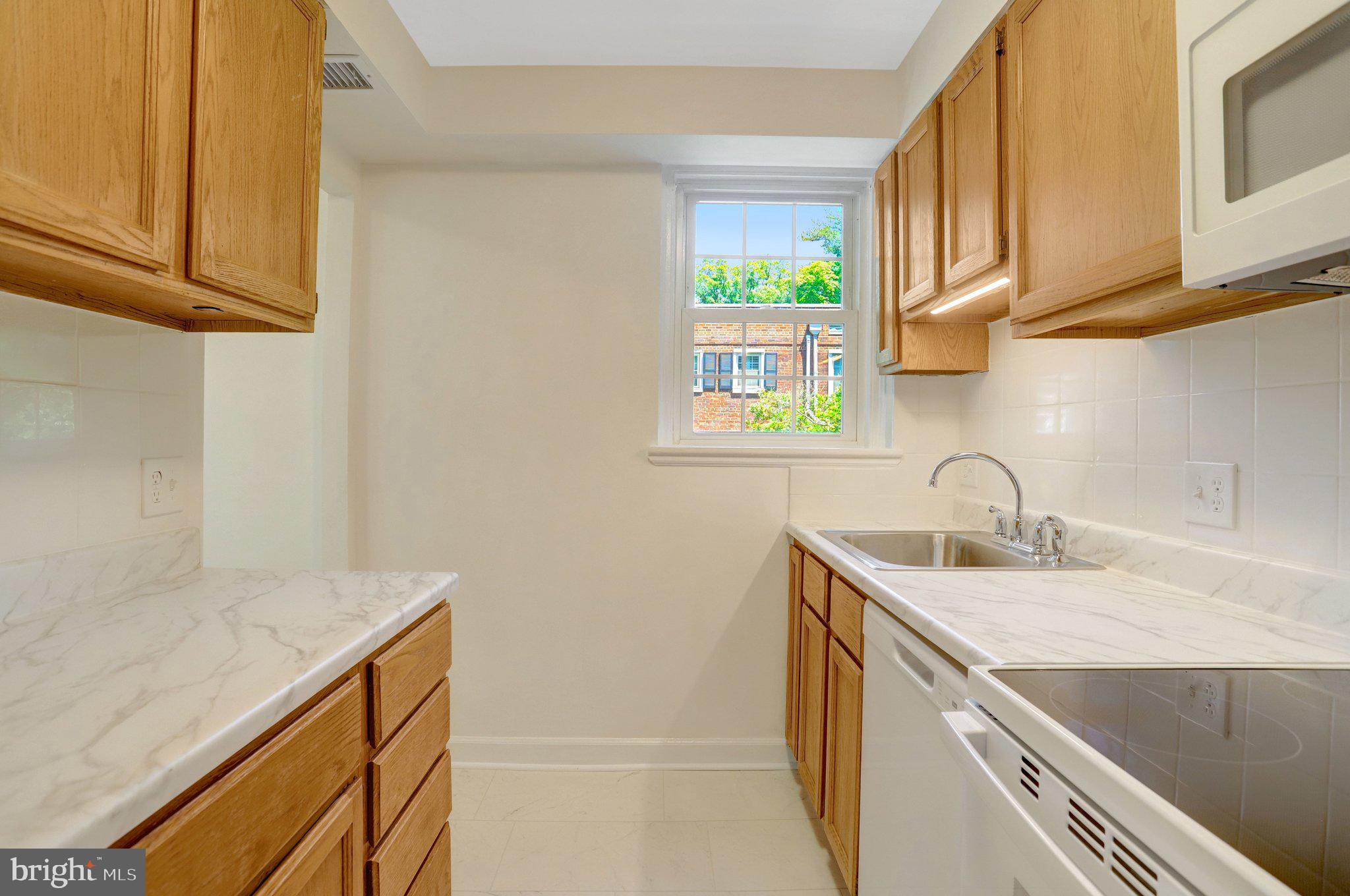 4837 27th Road South Arlington, VA 22206 - Photo 3 of 34 a view of a kitchen with sink and dishwasher
