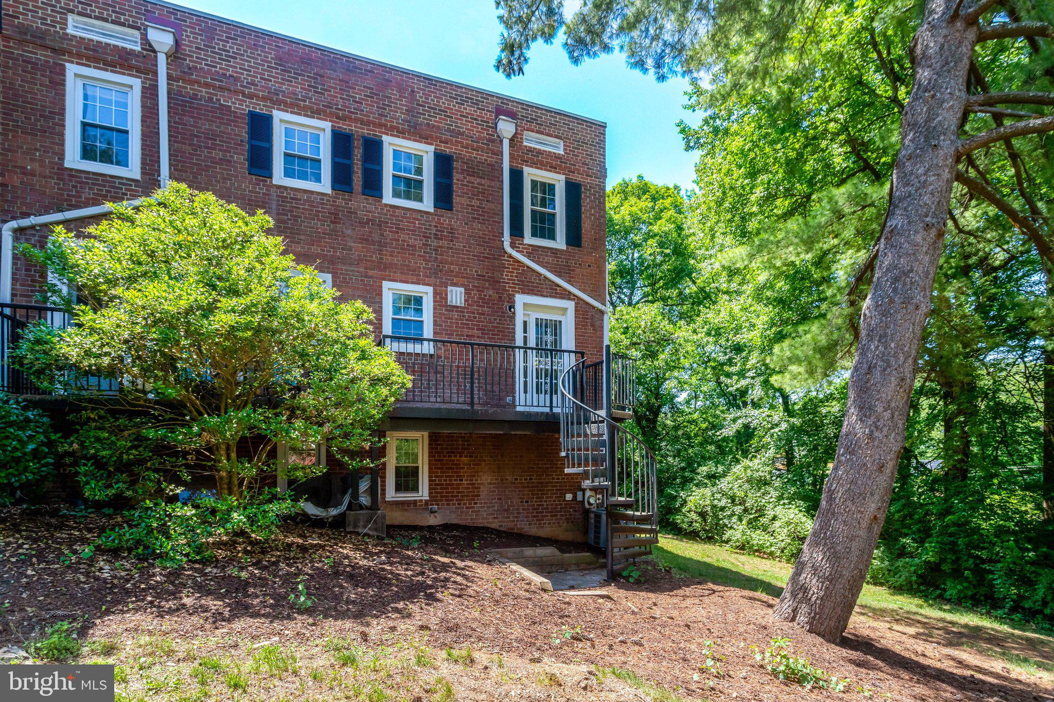 4837 27th Road South Arlington, VA 22206 - Photo 31 of 34 a view of a brick house with a yard