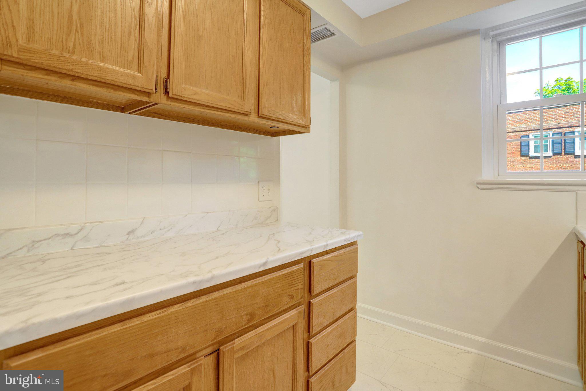 4837 27th Road South Arlington, VA 22206 - Photo 6 of 34 a view of storage and utility room with window